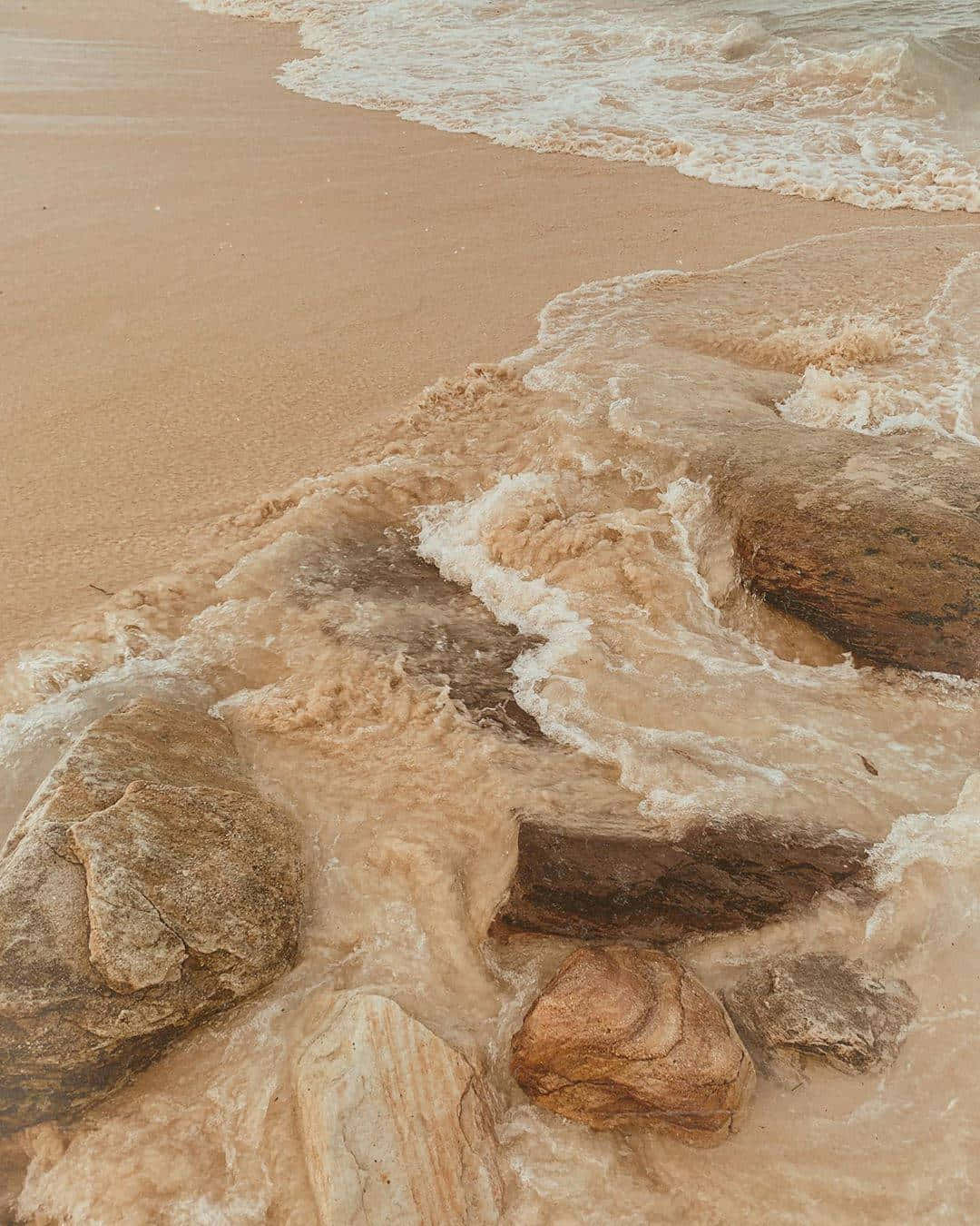 Beige Tan Beach Waves Rocks.jpg Wallpaper