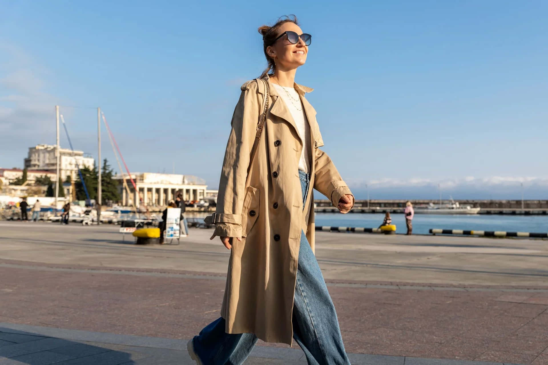 Beige Trench Coat Woman Walking Seaside Wallpaper