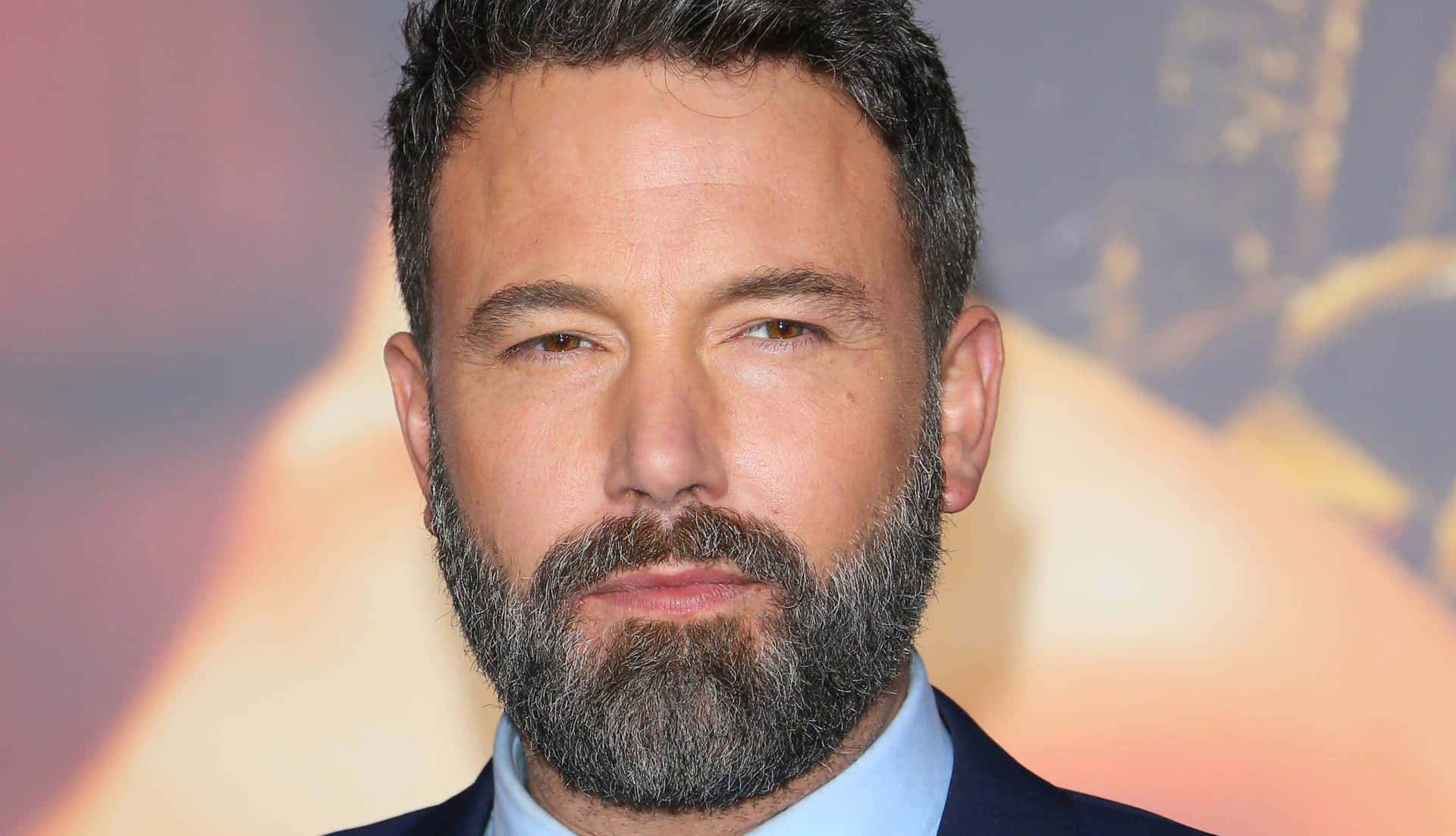 Ben Affleck looking out of a city window