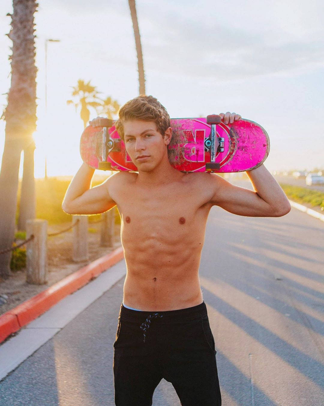 Ben Azelart Carrying A Skateboard Wallpaper