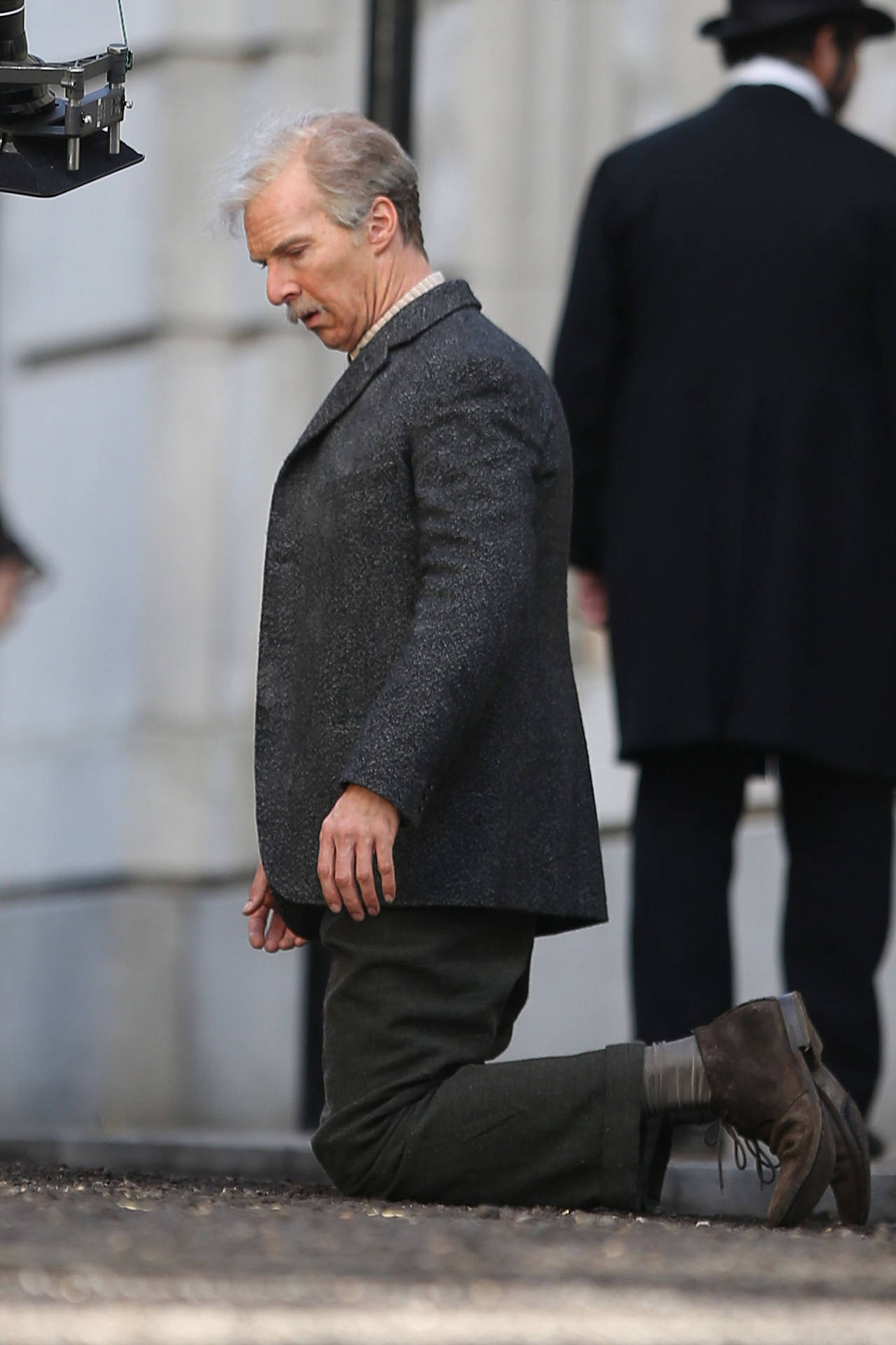 Benedict Cumberbatch Kneeling On Ground Background