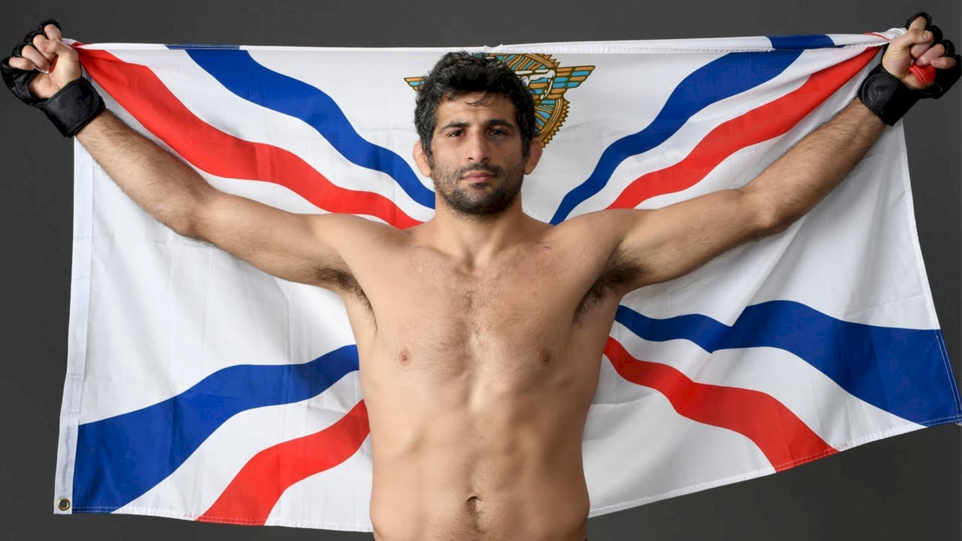Beneil Dariush Holding Assyrian Flag Wallpaper