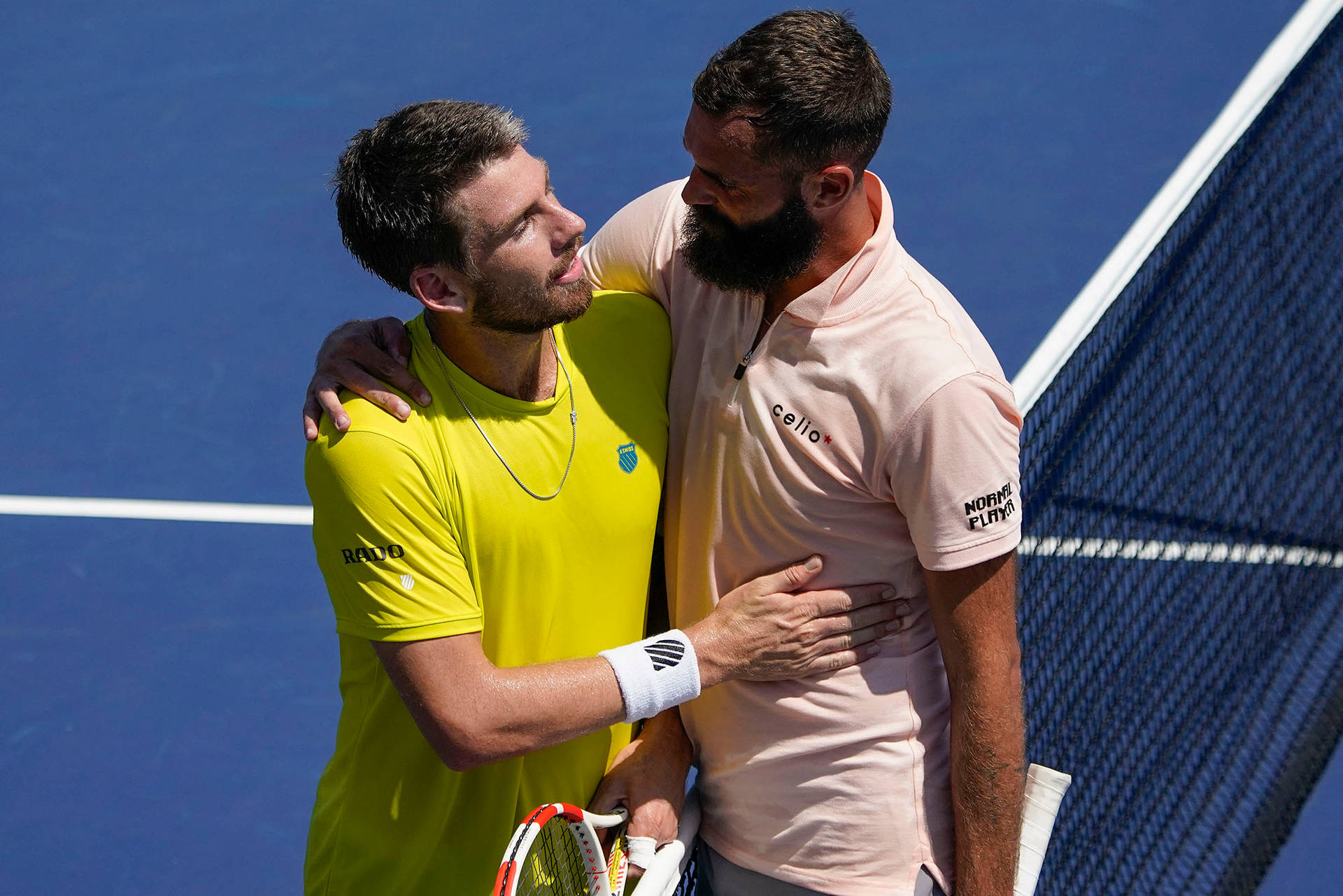 Benoit Paire and Cameron Norrie sharing an embrace after a tennis match. Wallpaper