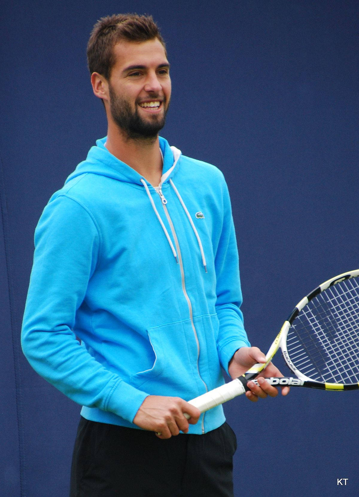 Benoit Paire Smiling While Holding Racket Wallpaper