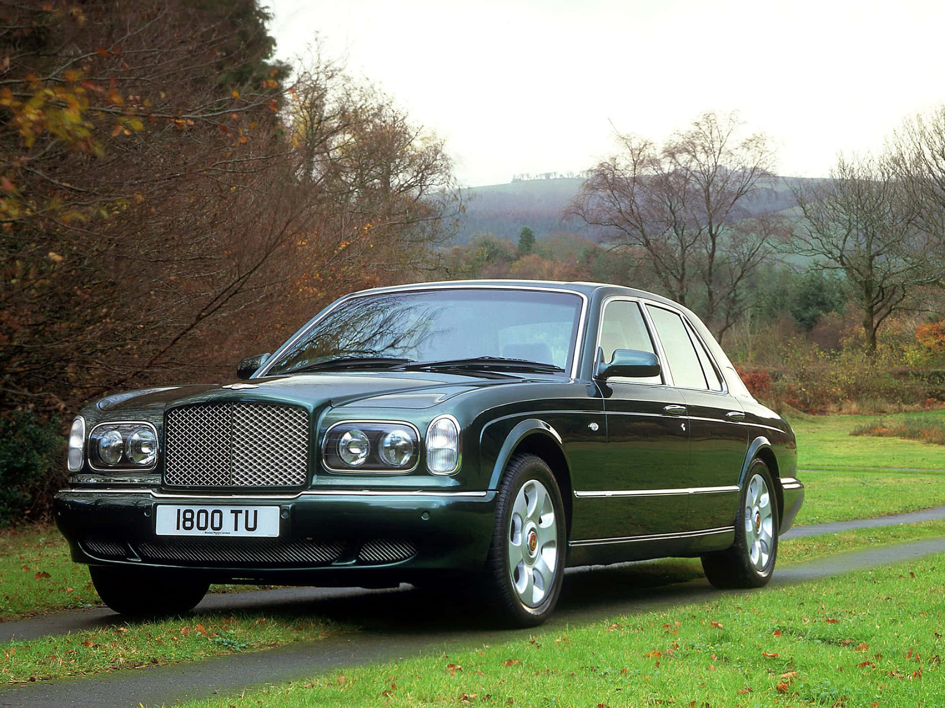 Sleek Bentley Arnage on a Scenic Road Wallpaper