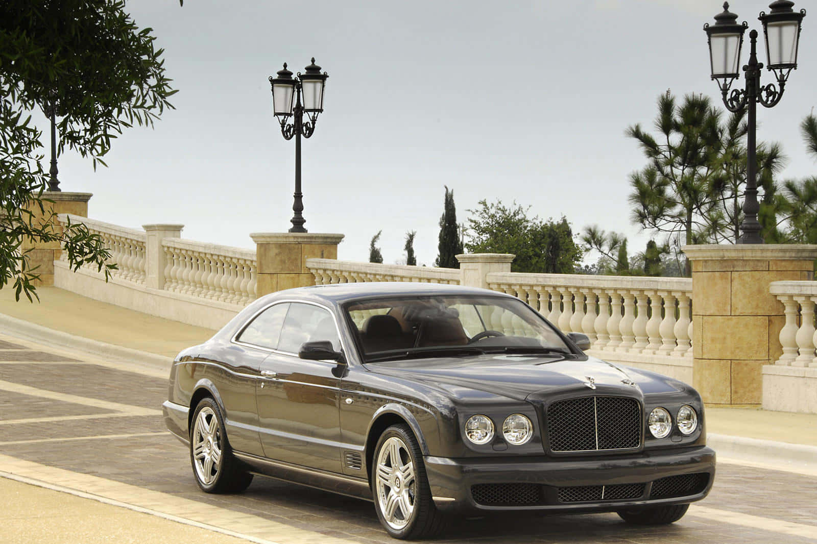 Caption: A classic Bentley Brooklands luxury car showcasing its elegance and style. Wallpaper