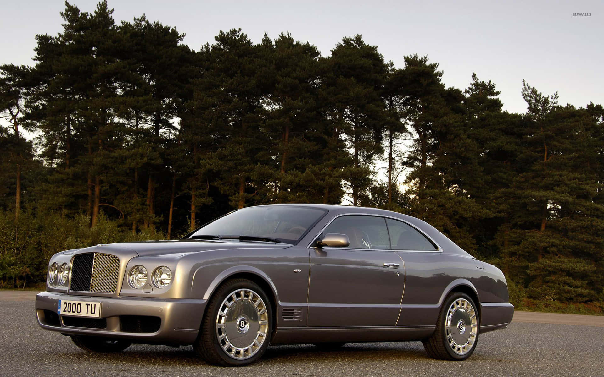 Elegant Bentley Brooklands cruising down the road Wallpaper