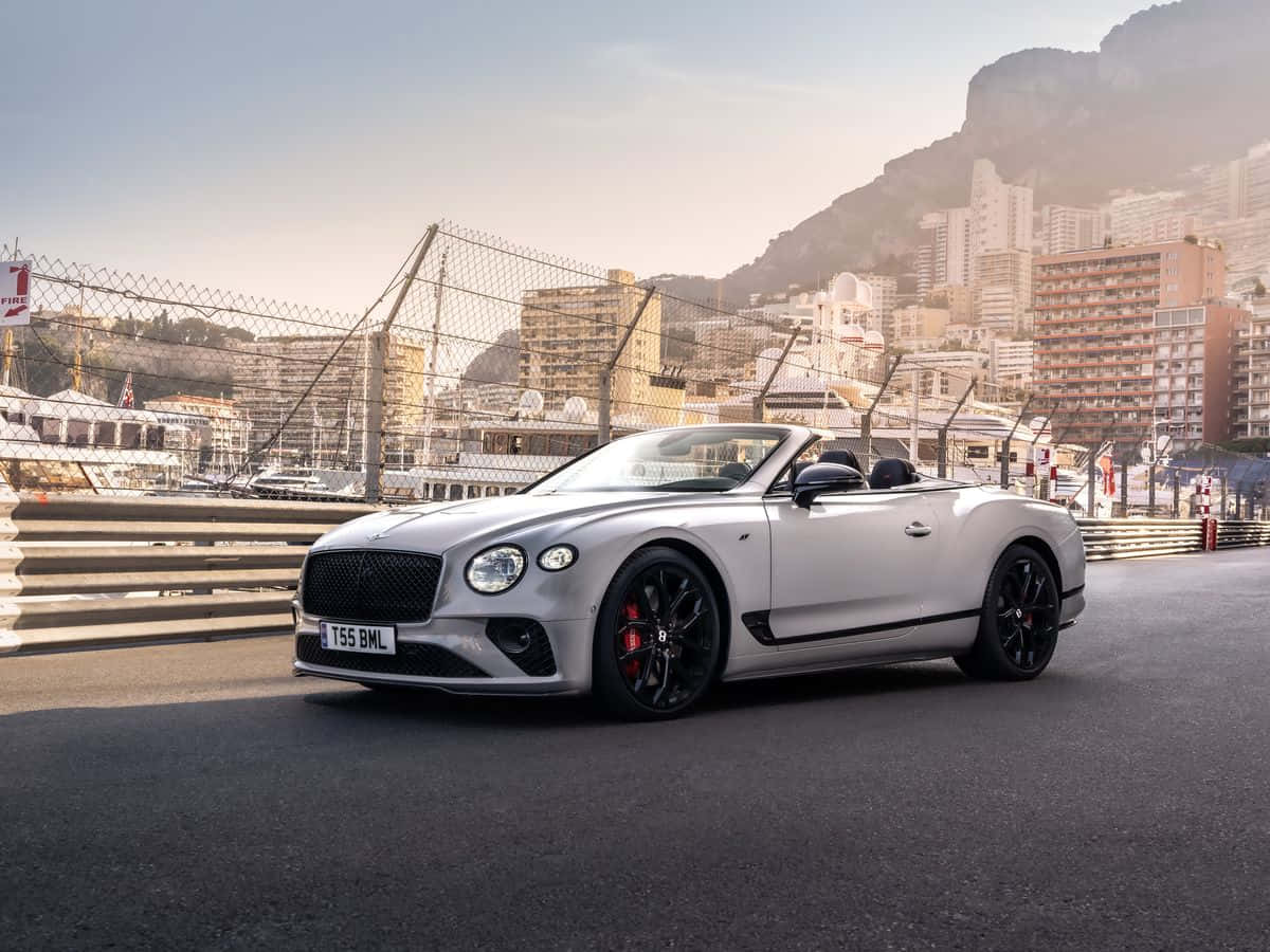 Sleek Bentley Continental GT in an urban backdrop. Wallpaper
