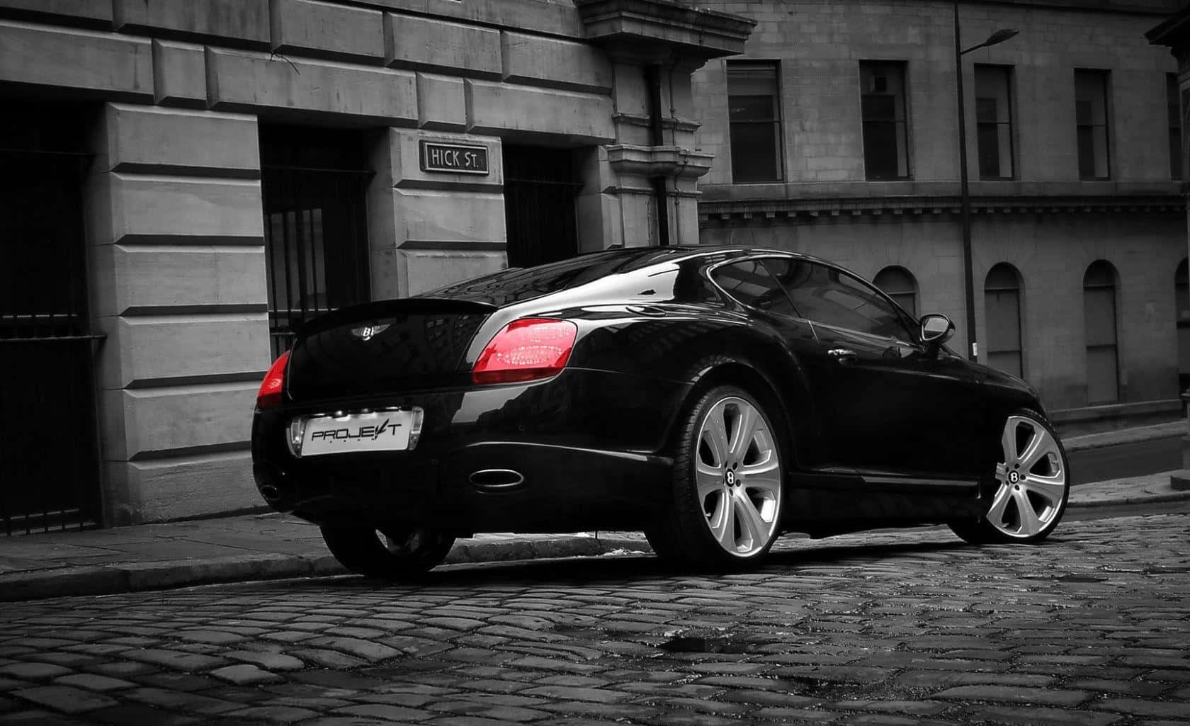 Caption: Luxury Meets Performance: The Bentley Continental GT Wallpaper