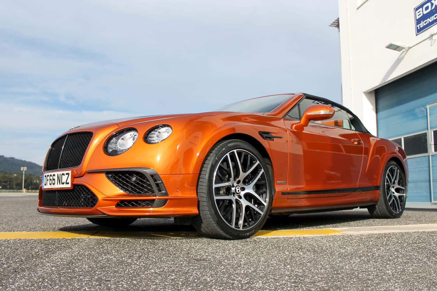 Caption: Magnificent Bentley Continental Supersports in Action Wallpaper