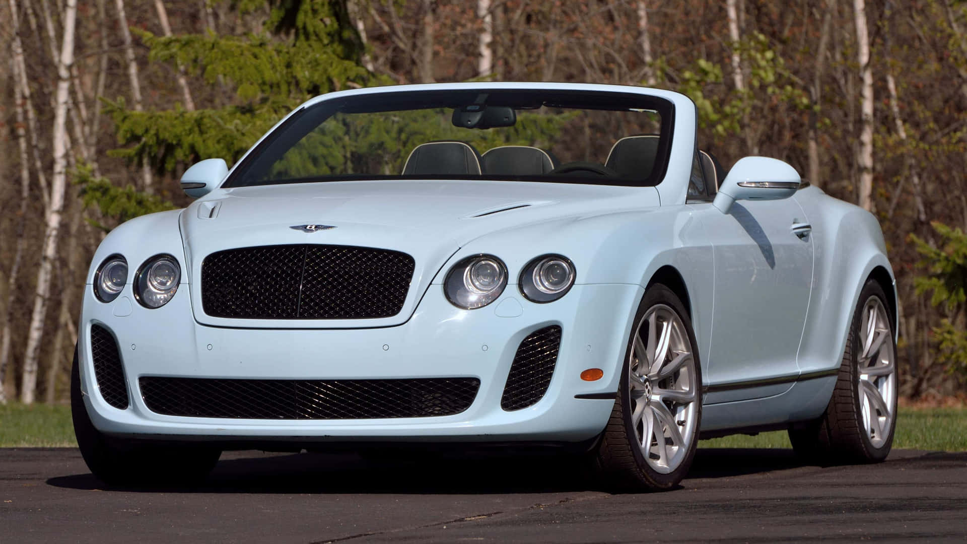 Sleek Bentley Continental Supersports in Action Wallpaper