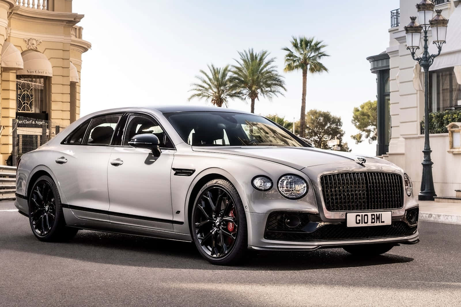 Luxurious Bentley Flying Spur cruising on the road Wallpaper