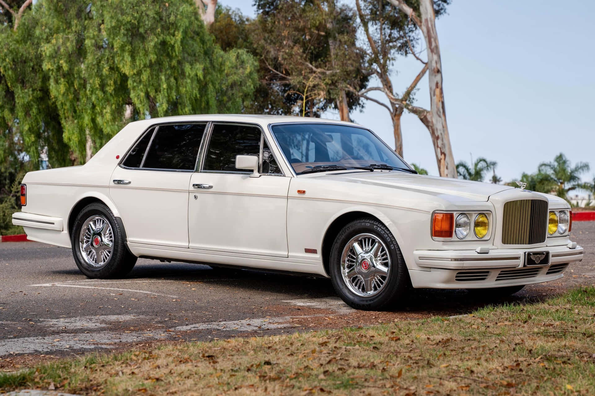 Caption: A Classic Bentley Turbo R on the Road Wallpaper