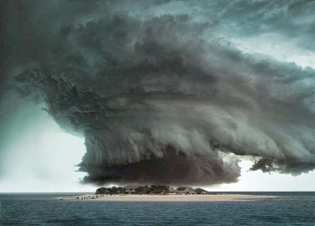 A Large Storm Cloud Is Seen Over An Island