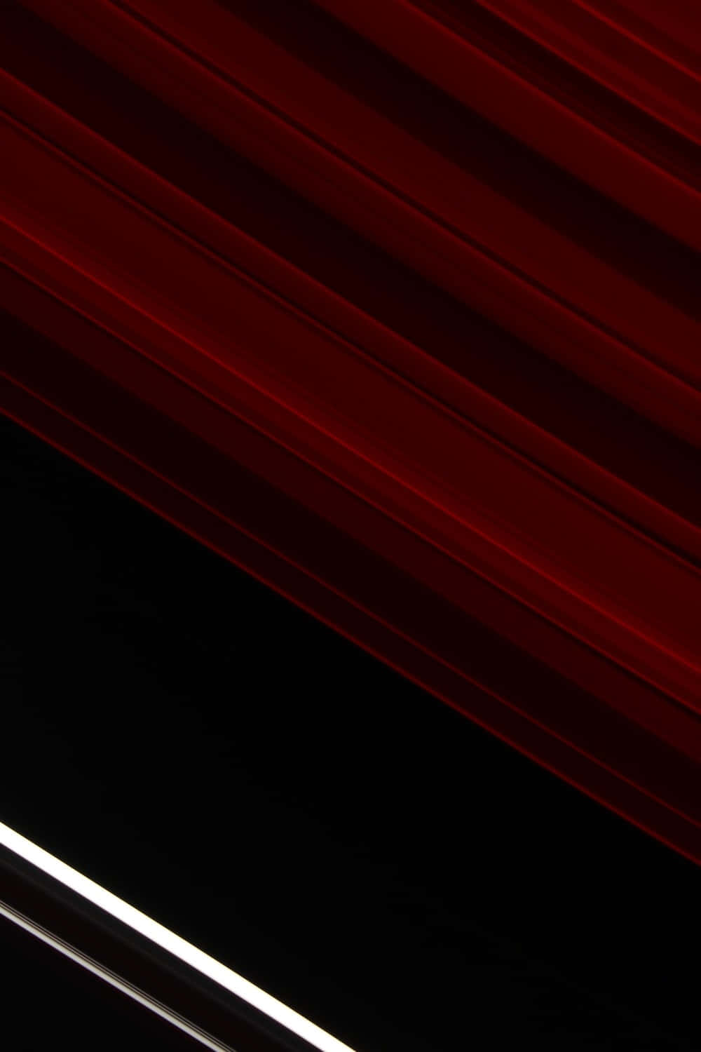 A Red And Black Image Of A Saturn