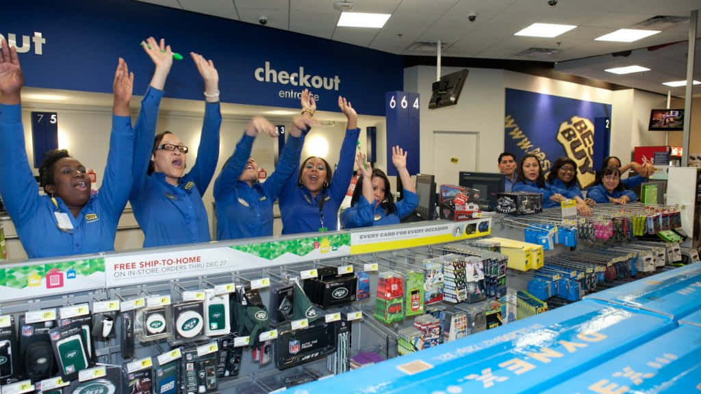 A Group Of People In Blue Uniforms Are Standing In A Store