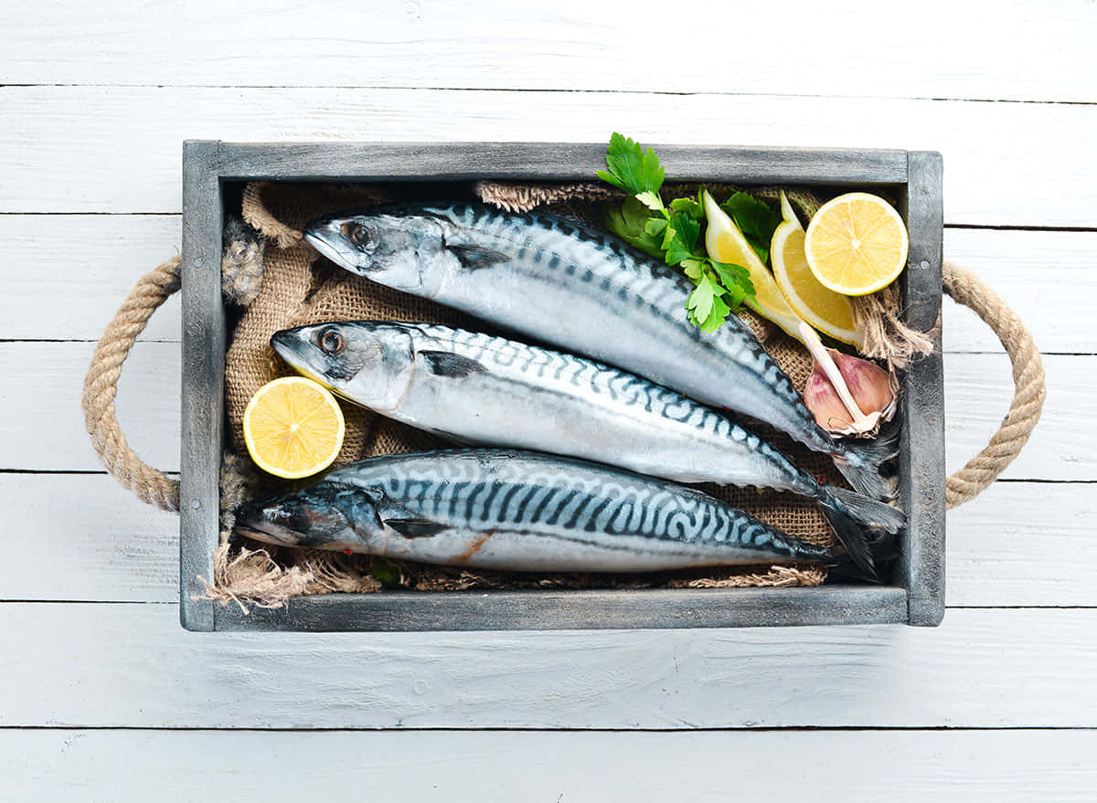 Fish In A Wooden Box With Lemon And Herbs