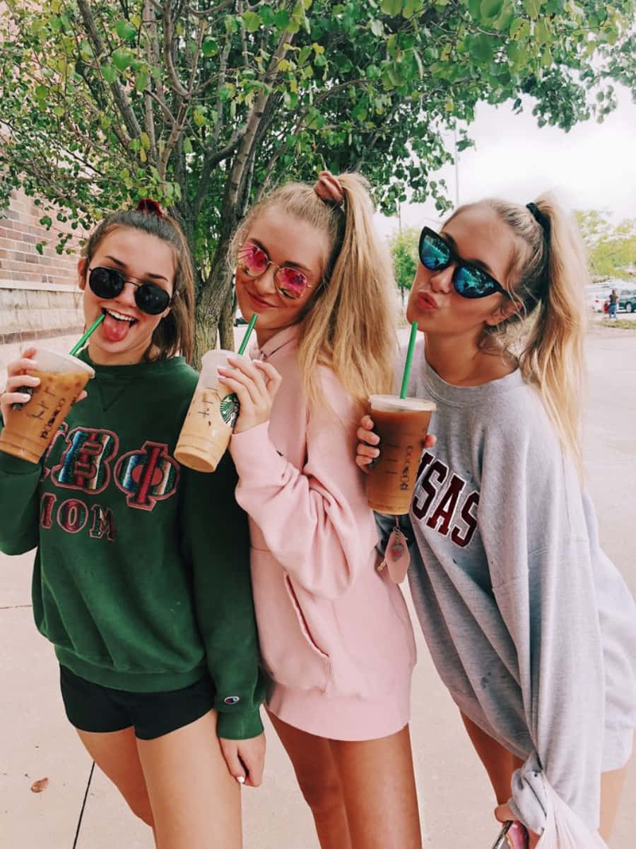 Best Friends Holding Starbucks Coffee Picture