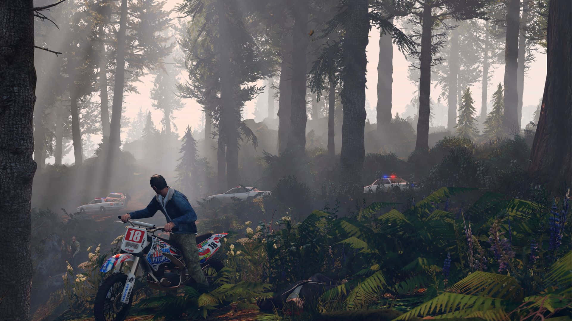 a man riding a motorcycle through the forest