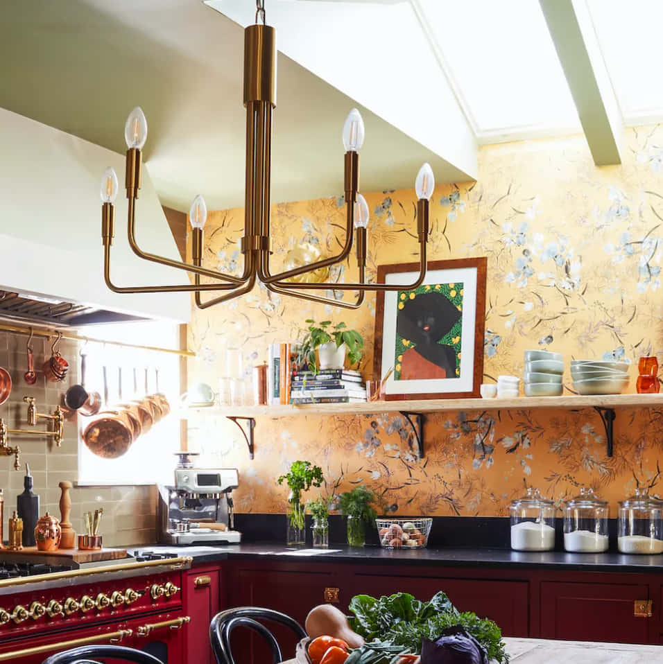 A Kitchen With Red And Yellow Walls And A Chandelier