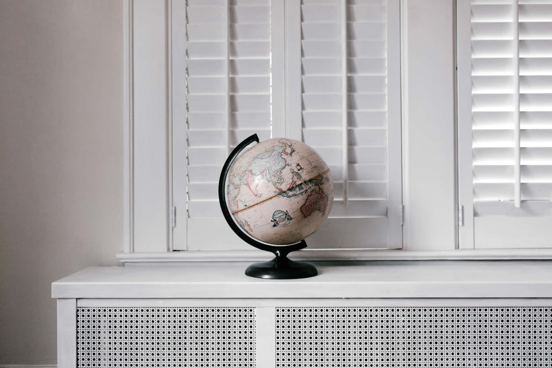 A Globe On A Window Sill