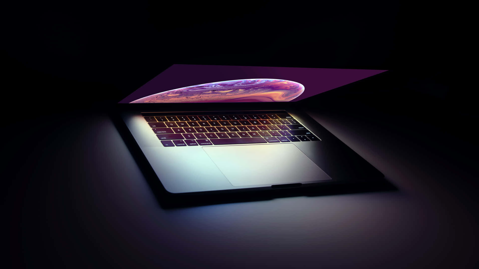 A Laptop With A Purple Screen Is Shown In The Dark