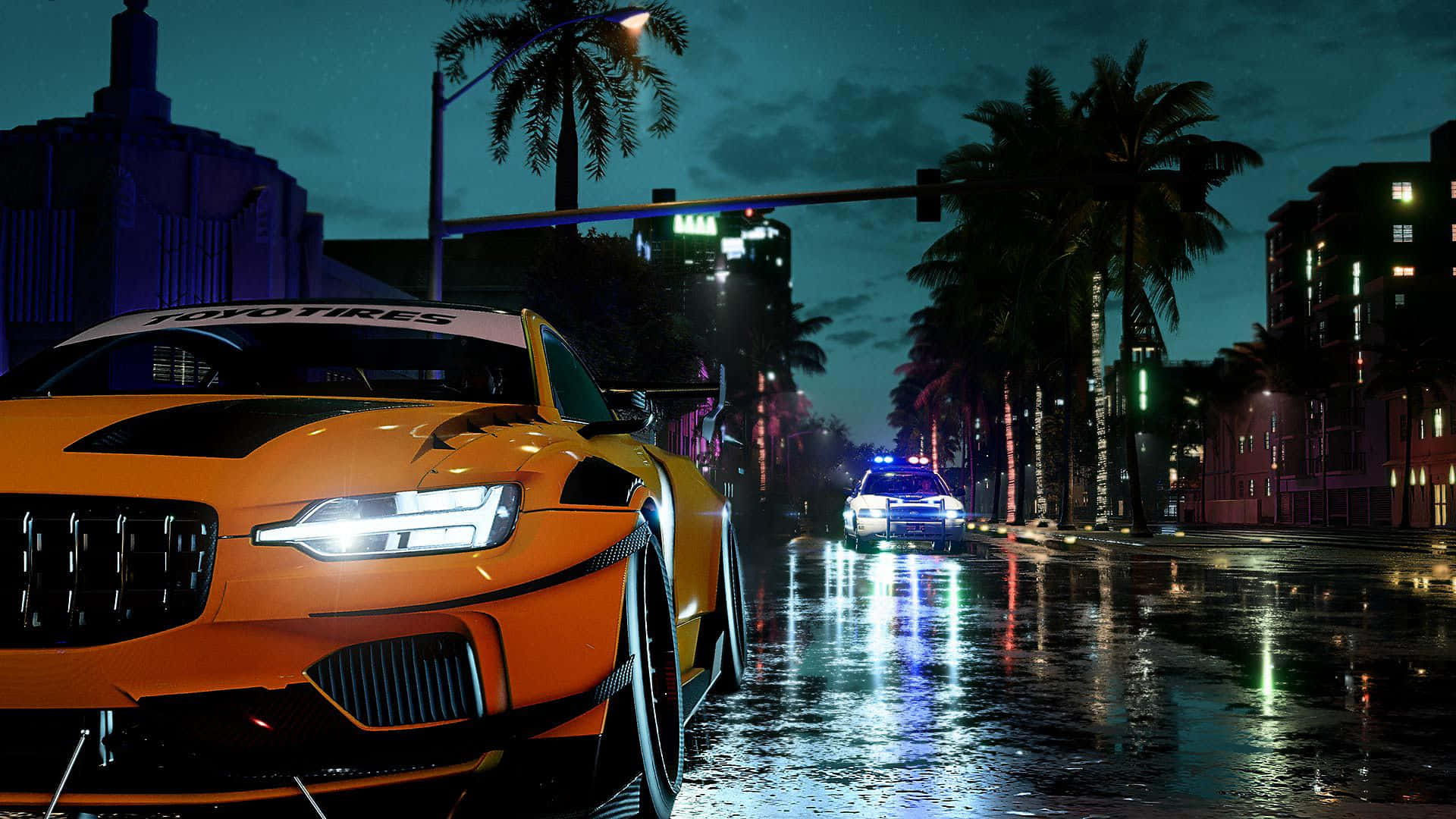 A Car Driving Down A City Street At Night