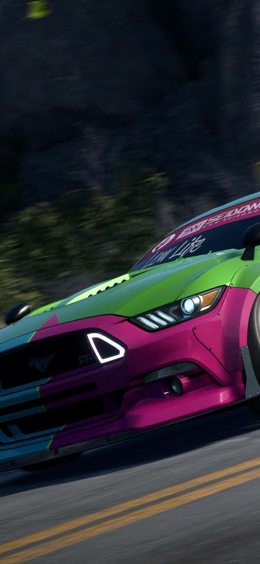 A Colorful Mustang Racing Car Is Driving Down A Mountain