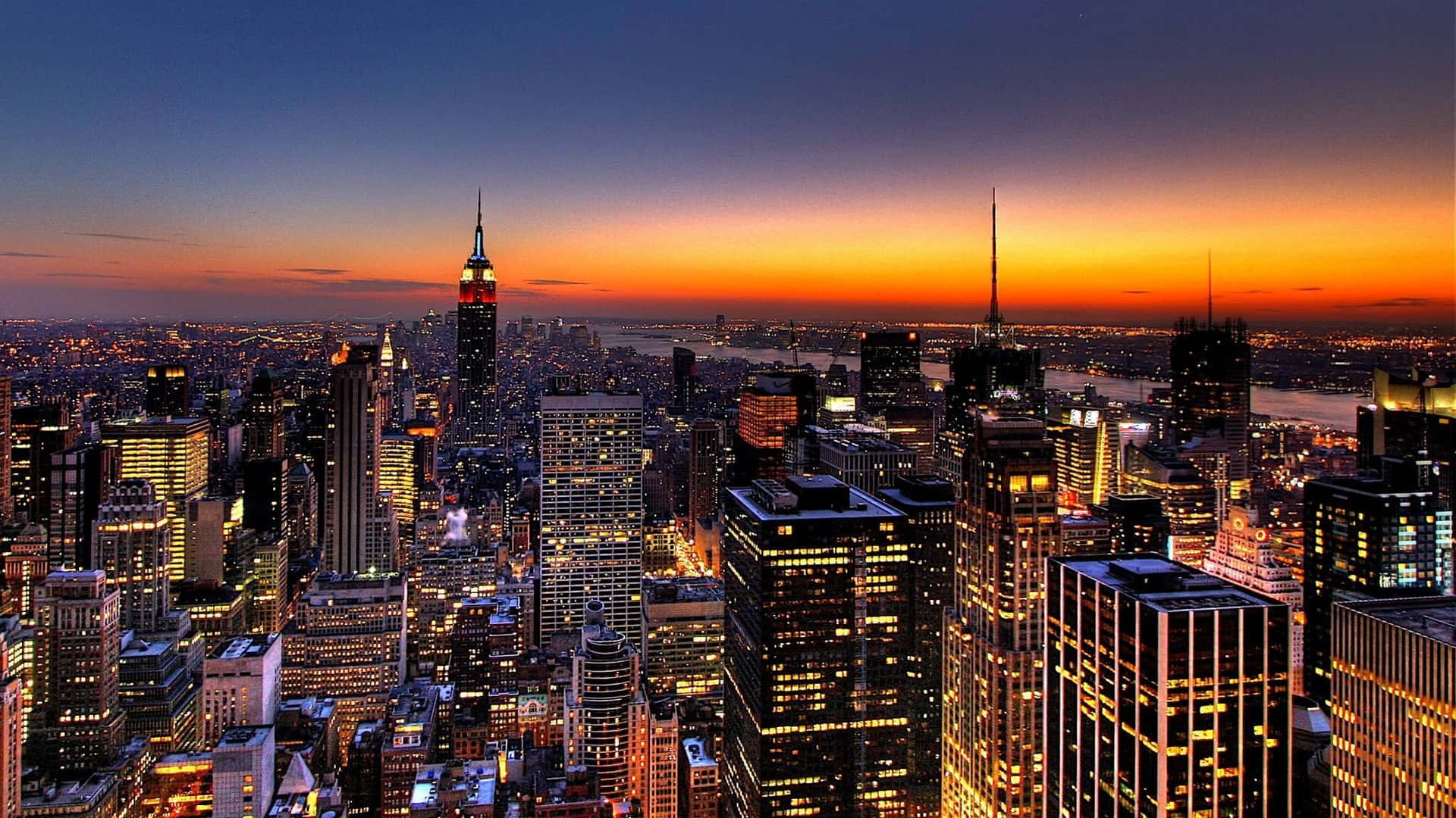 Sonnenuntergangsstadtbeste New York Hintergrund