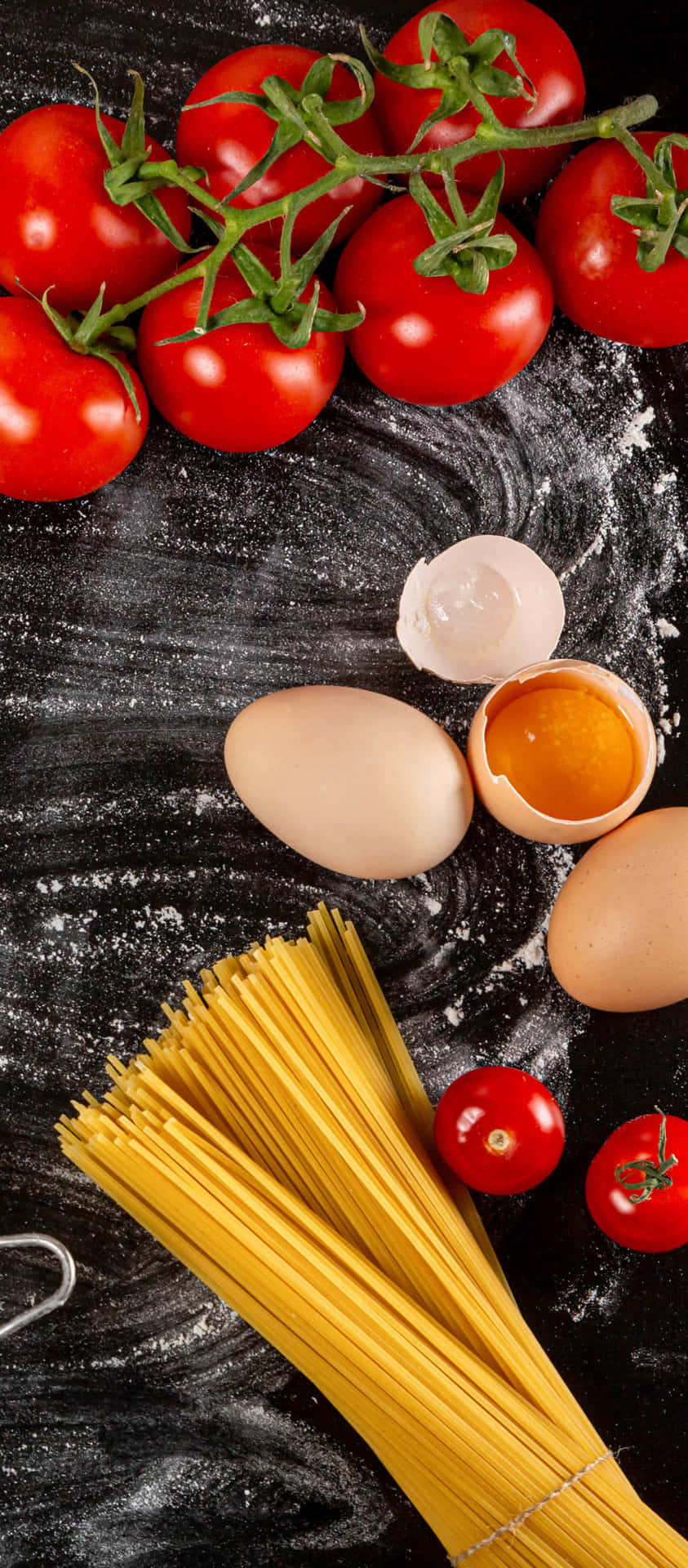 A Table With Pasta, Eggs, Tomatoes, And Other Ingredients