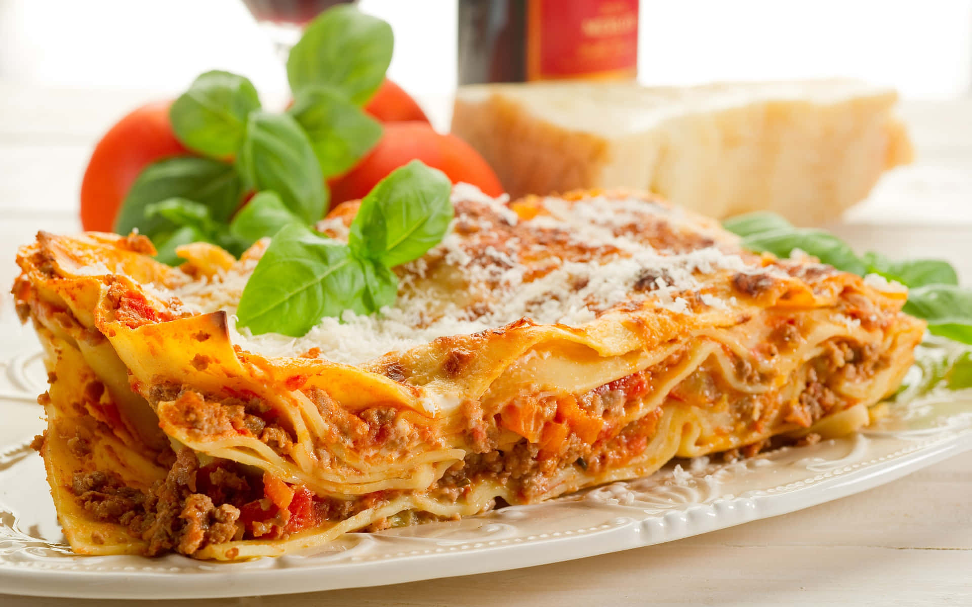 A Plate Of Lasagna With Meat And Vegetables On It