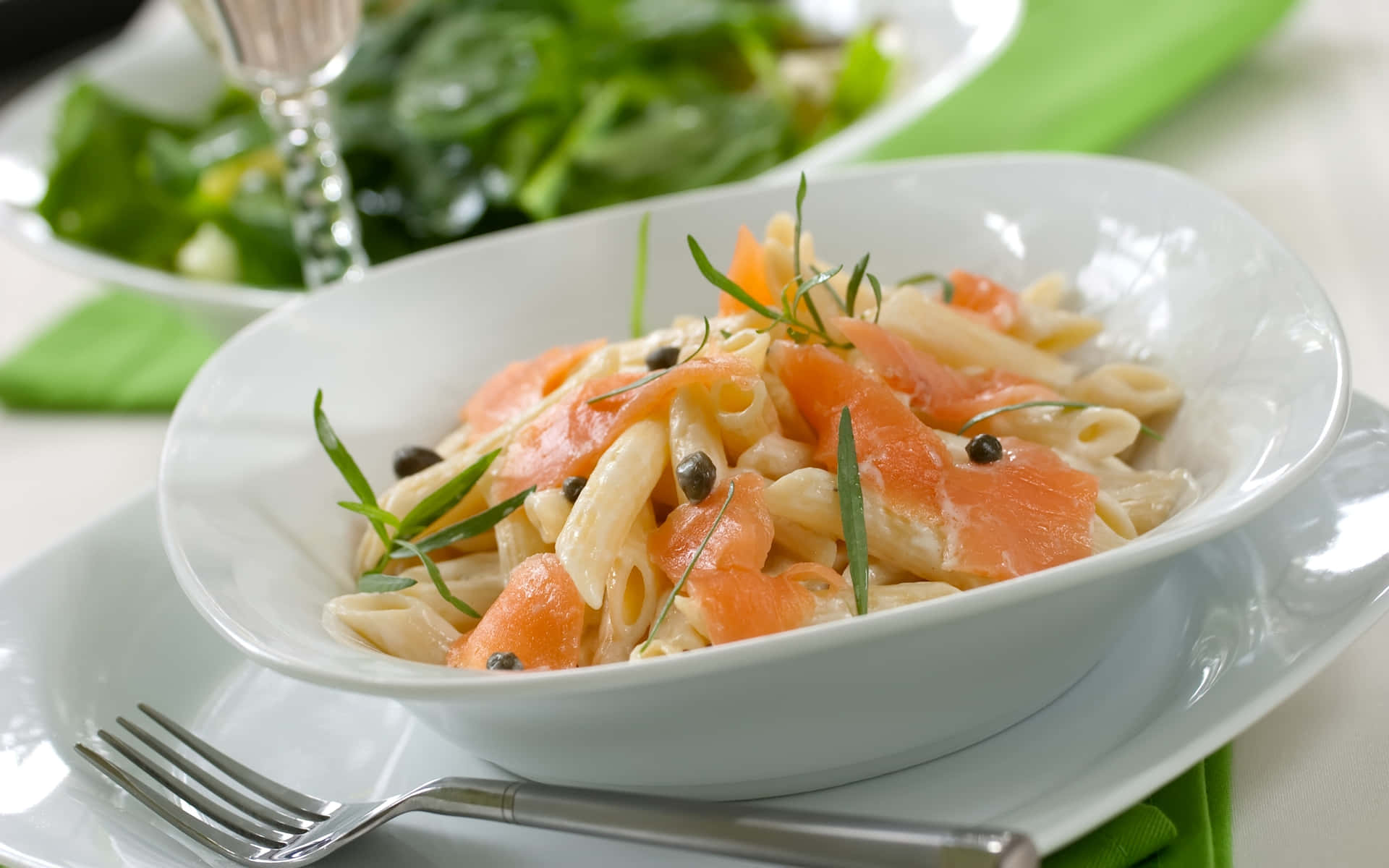 A Bowl Of Pasta With Smoked Salmon And Greens