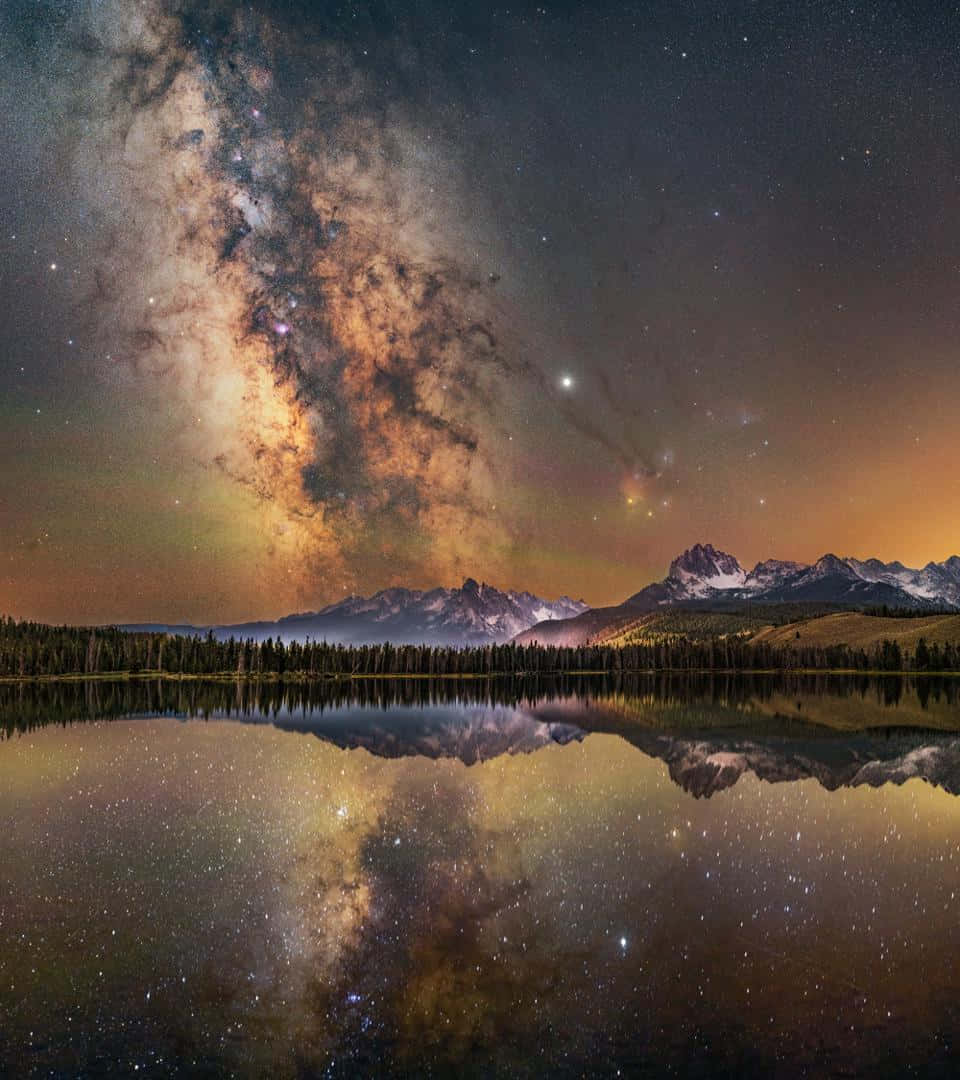 Milky Reflected In A Lake With Mountains