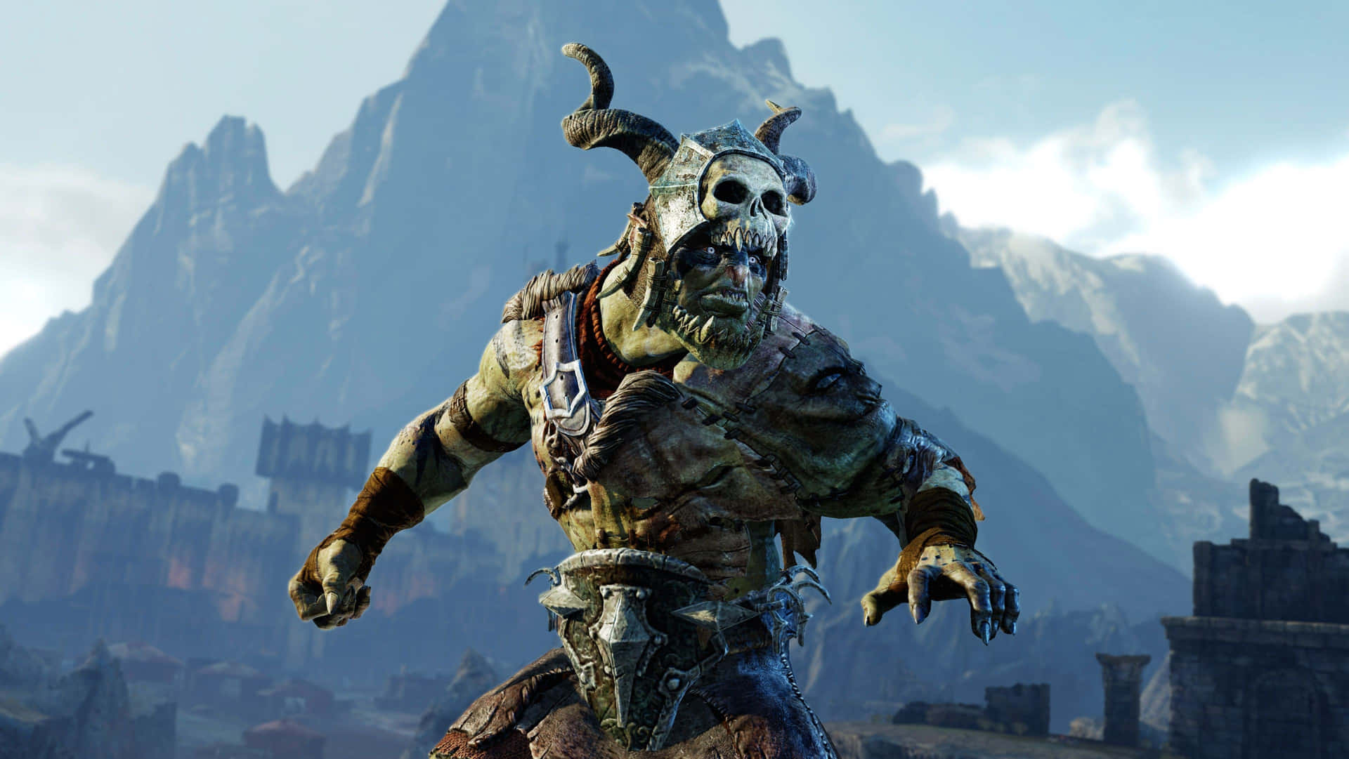 En karakter i et videospil står øverst oppe på en bjergtop.