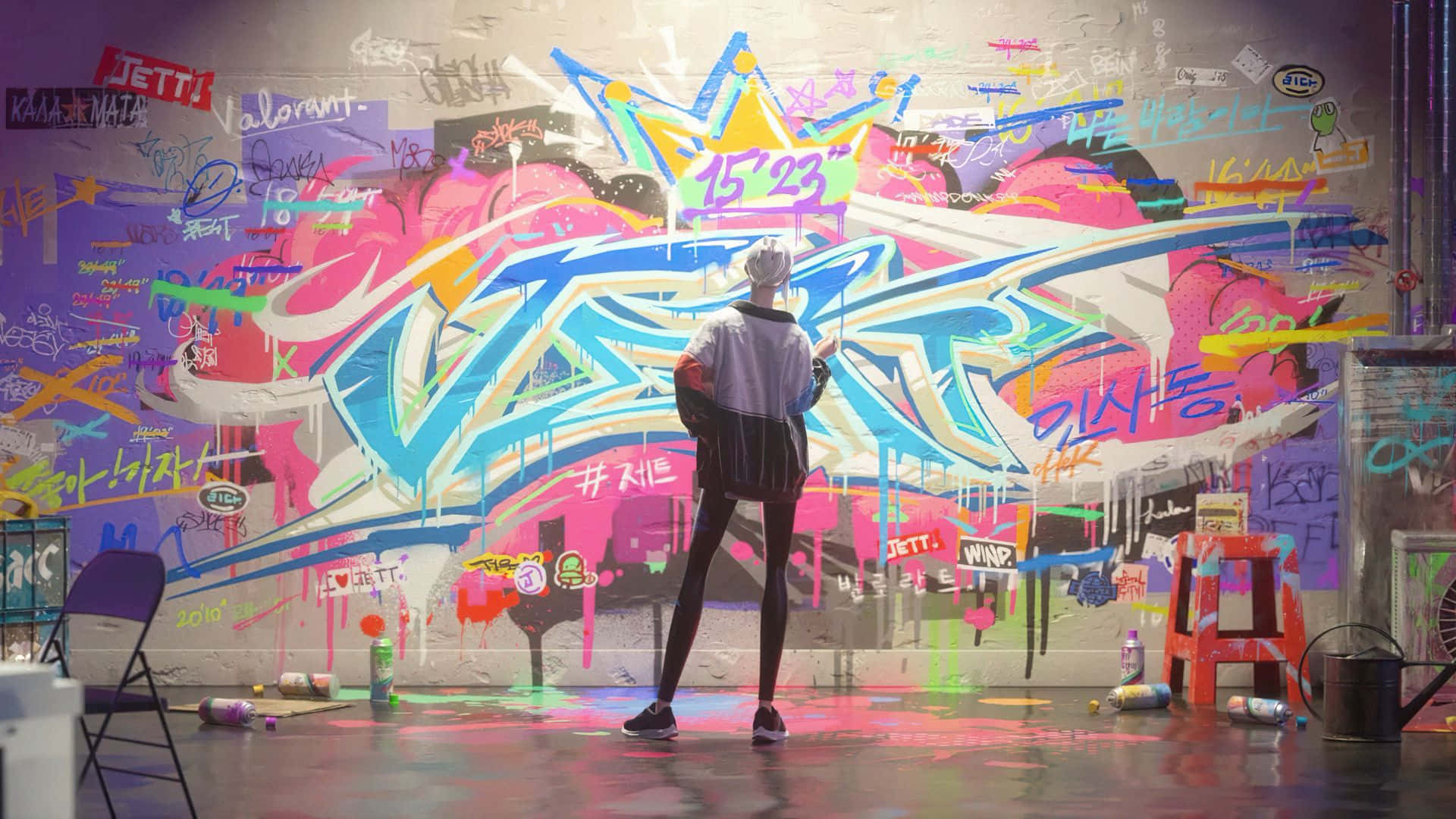 A Man Standing In Front Of A Room With Graffiti