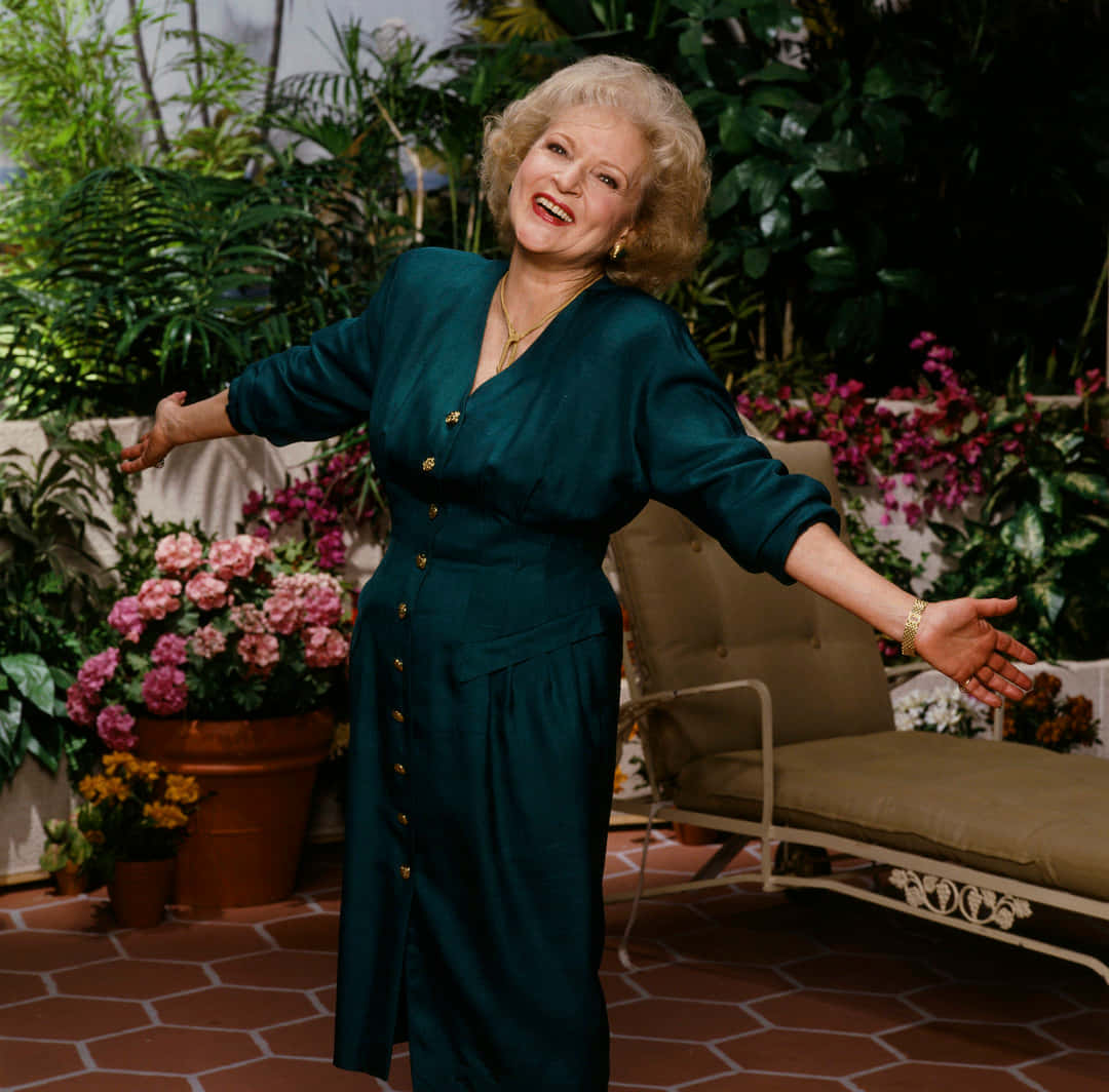 A radiant Betty White smiling warmly during her time on The Golden Girls