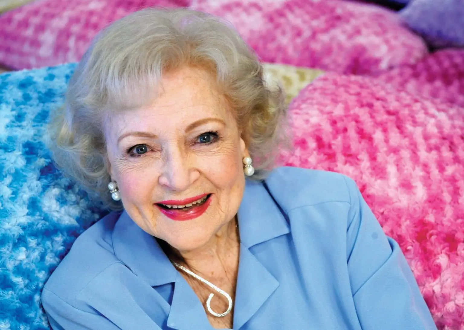 An elegant and charismatic Betty White in a close-up portrait