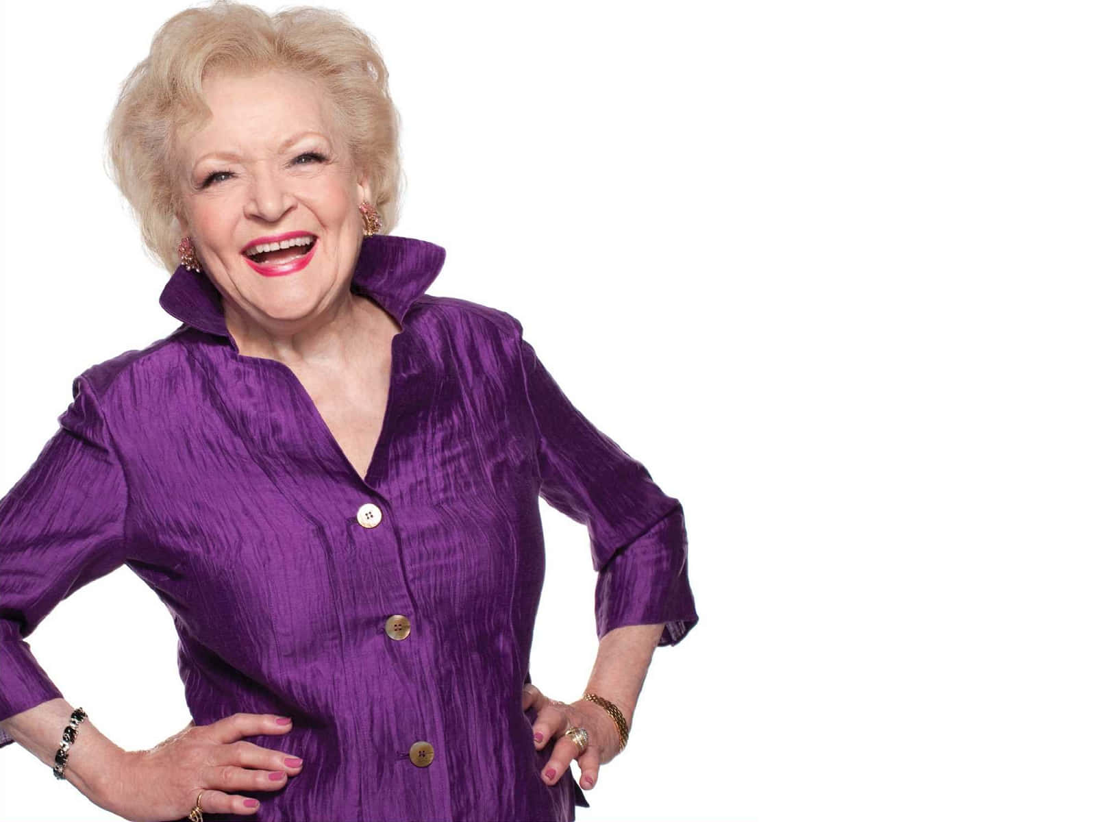 Betty White smiling in an elegant outfit