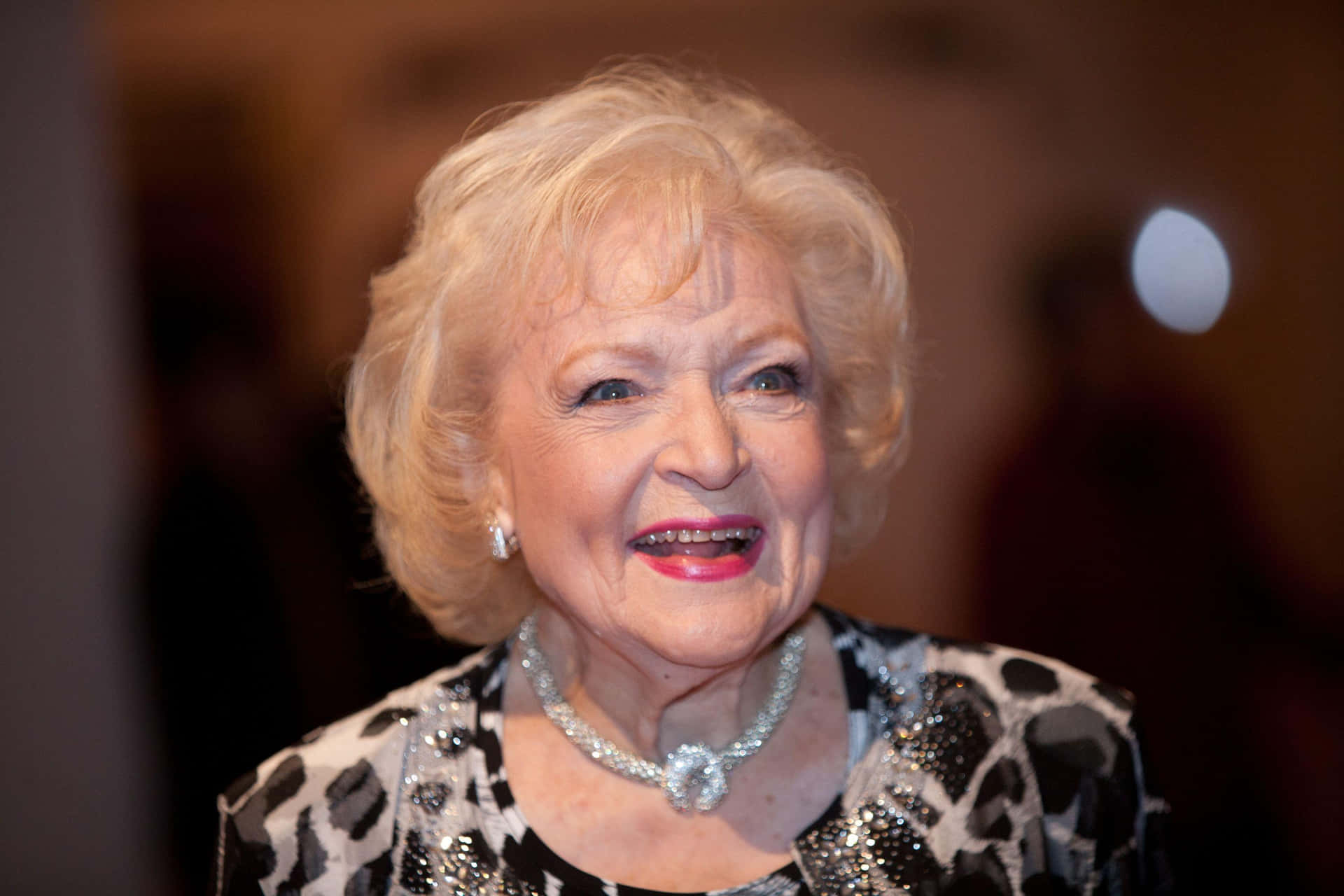 Betty White at a Hollywood event, smiling brightly