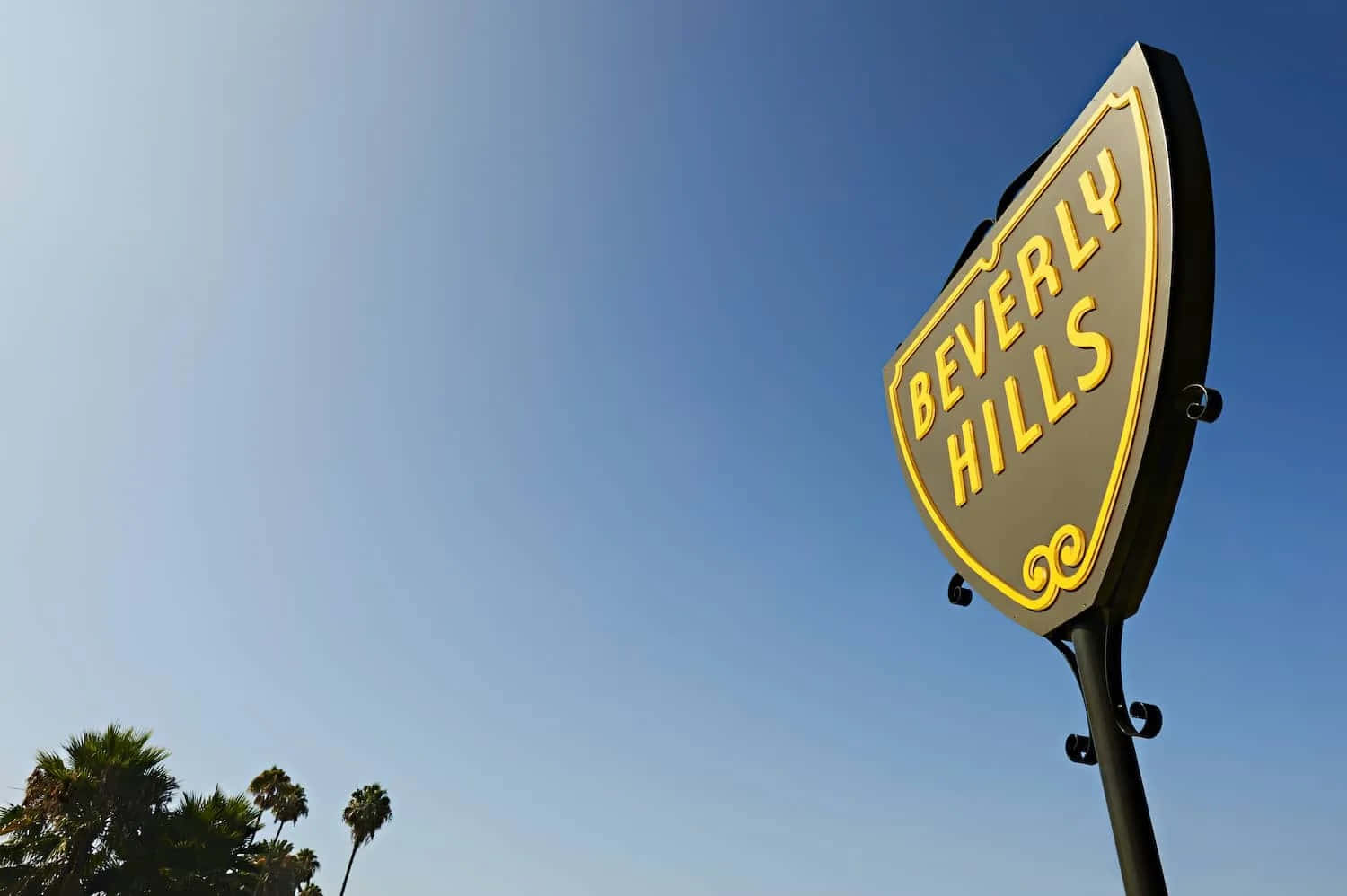 Beverly Hills Sign Against Blue Sky Wallpaper