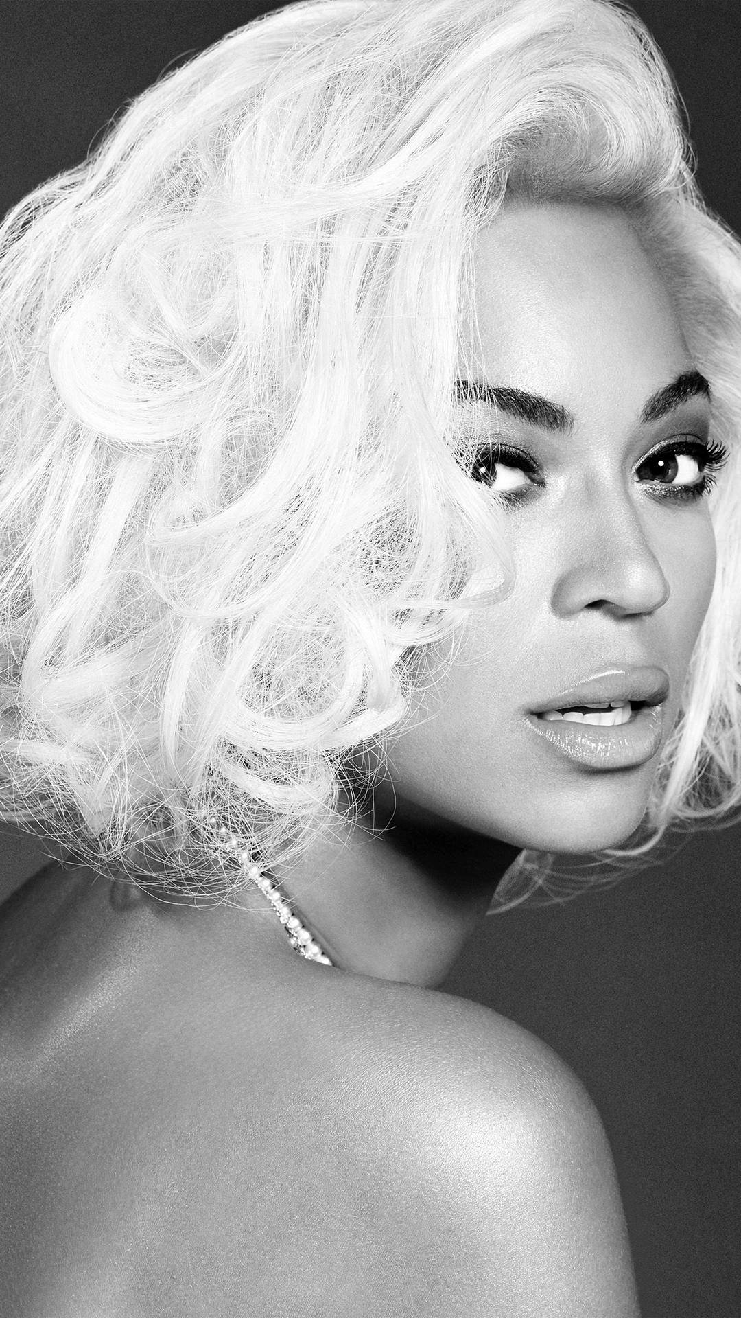 Beyonce strikes a pose with her iconic short bob. Wallpaper