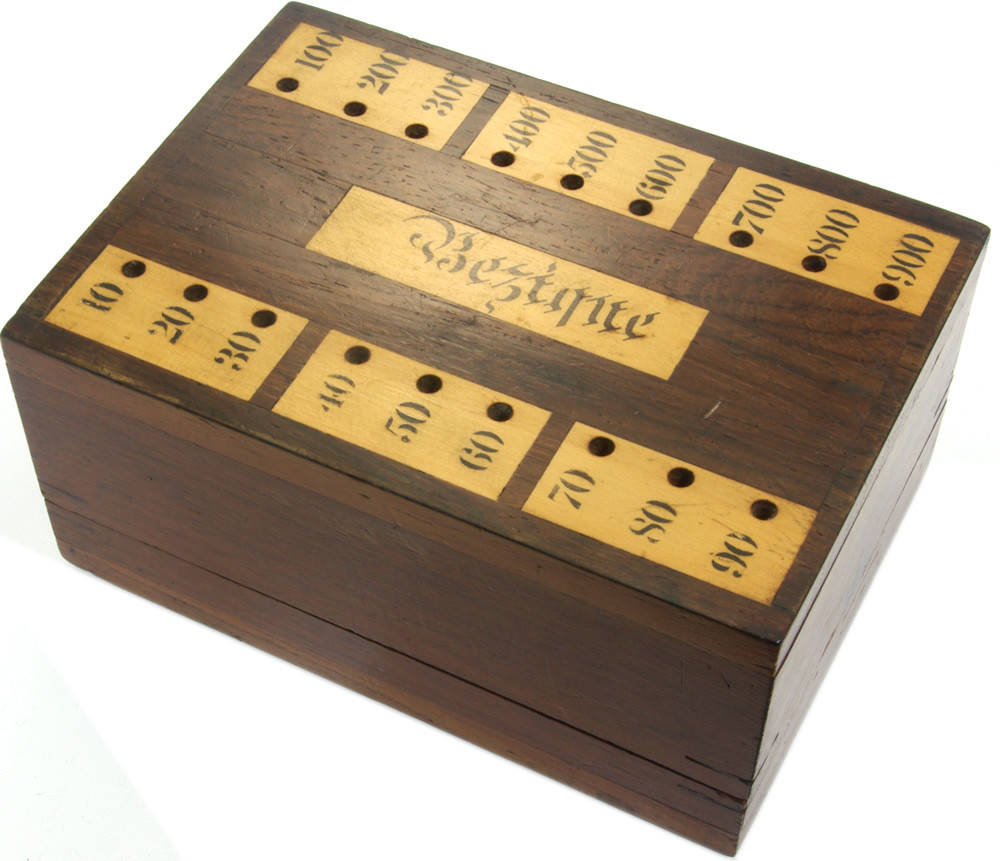 An elegant dark brown Bezique game box. Wallpaper