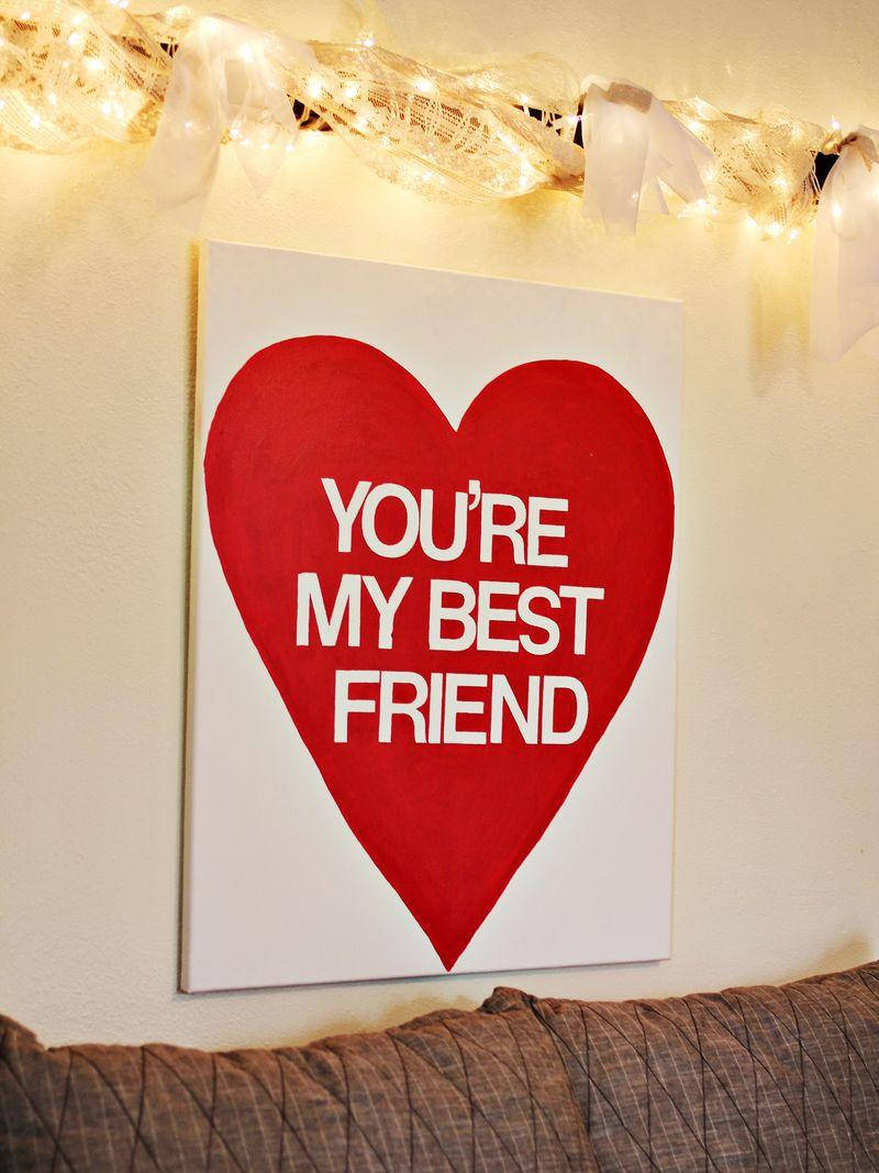 An endearing shot of a colorful BFF wall decoration on a wooden background. Wallpaper