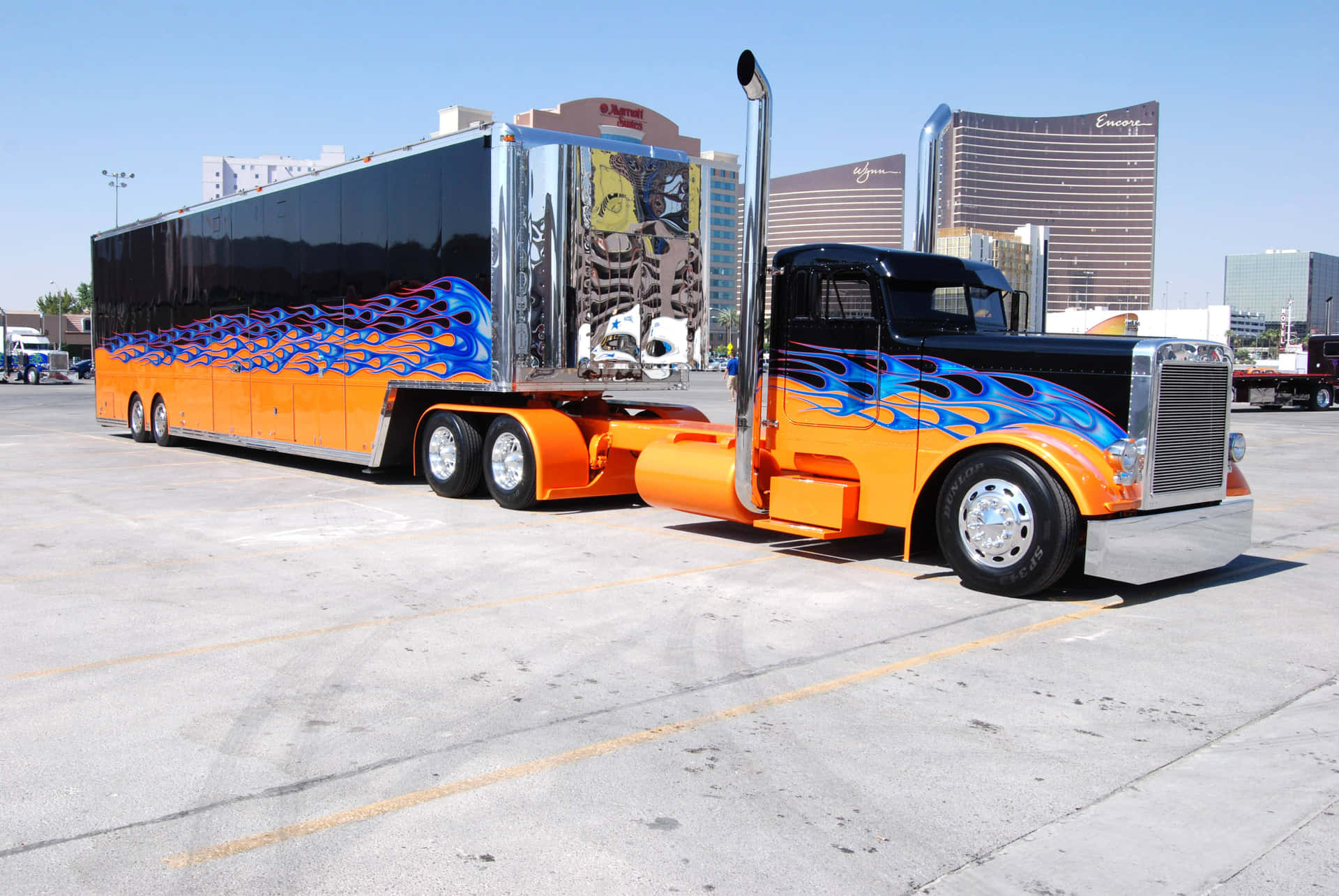A Large Truck With A Blue And Orange Paint Job