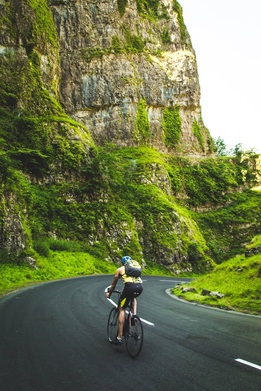 Bike Lover Riding By The Mountain Side