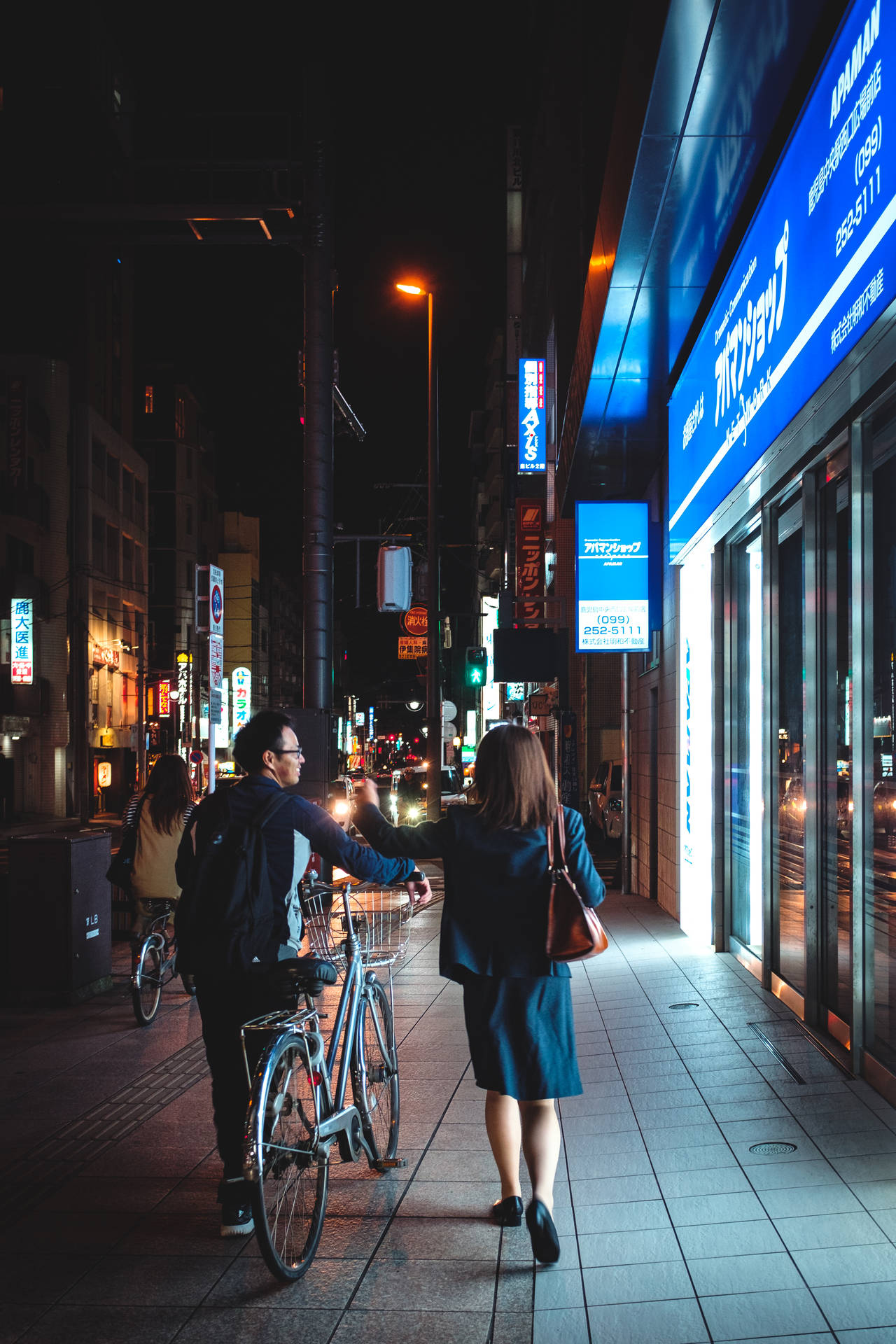 Bike Lovers Walking At Night