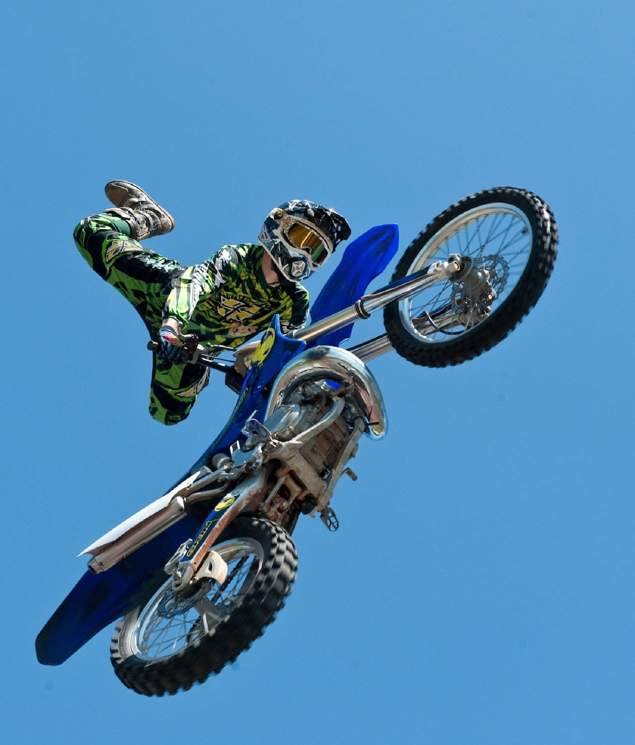 Bike Rider Performing A Motorcycle Stunt Wallpaper