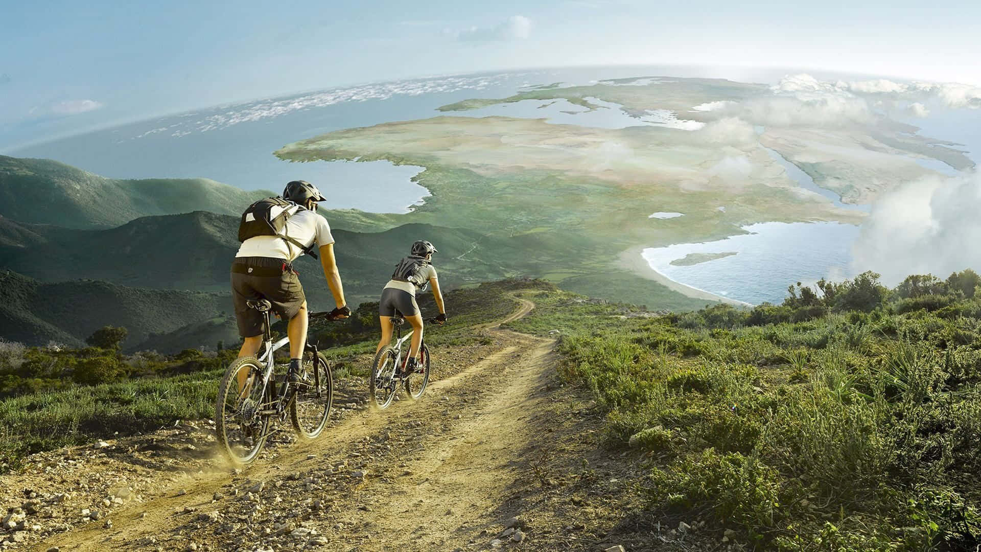 Two mountain bikers navigate the trails of a stunning natural landscape