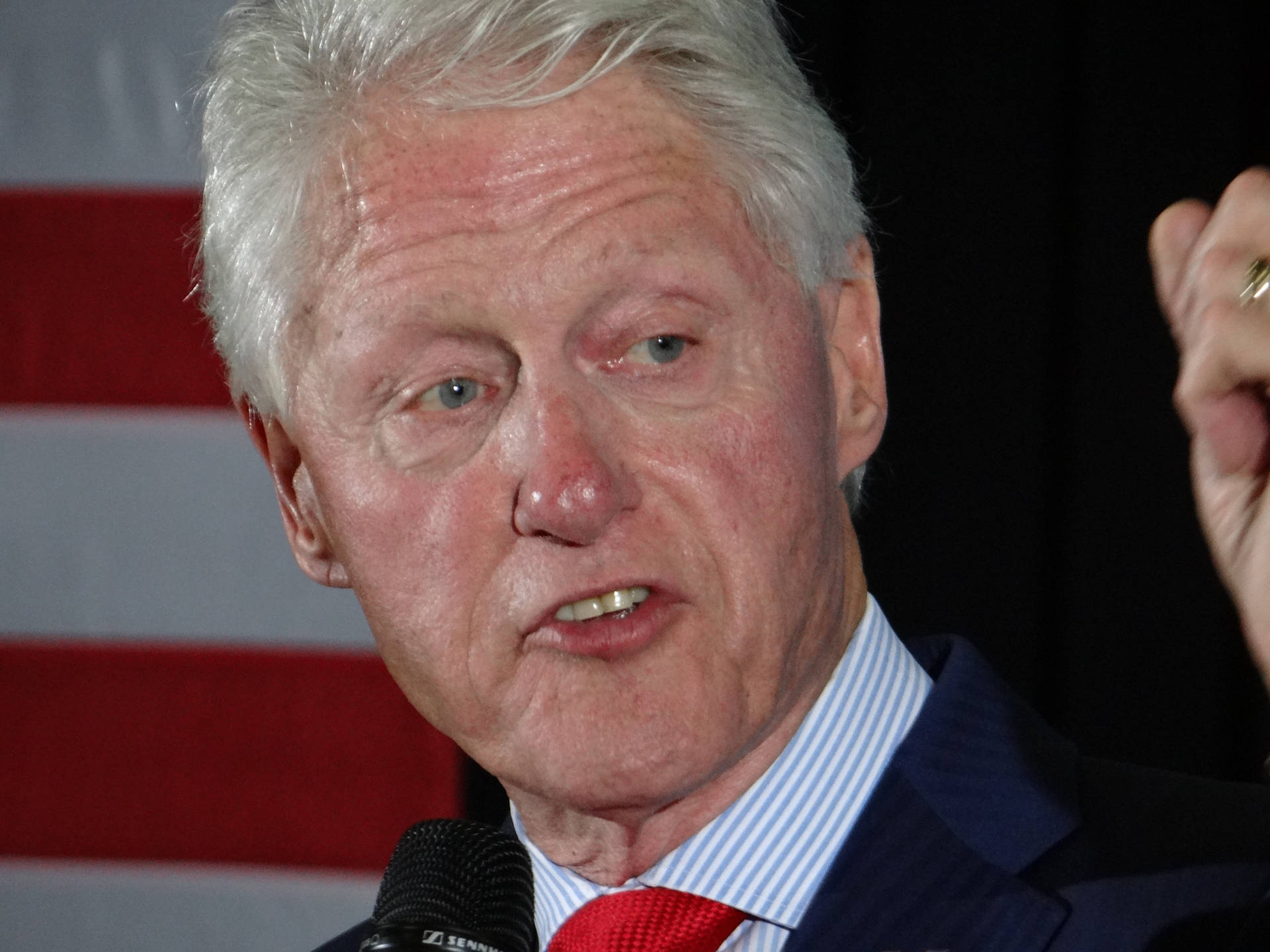Former president Bill Clinton with a focused expression Wallpaper