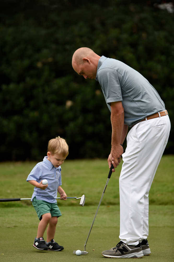 Bill Haas Playing With A Baby Wallpaper